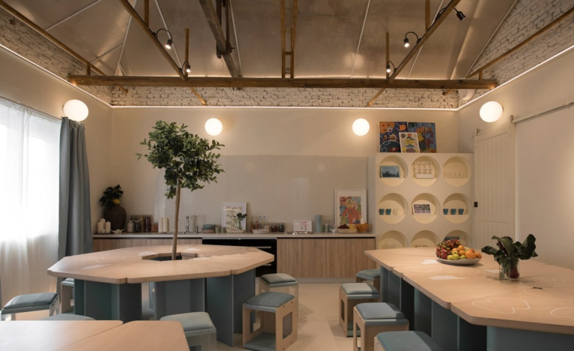An industrial-style kitchen with concrete countertops and exposed brick walls.
