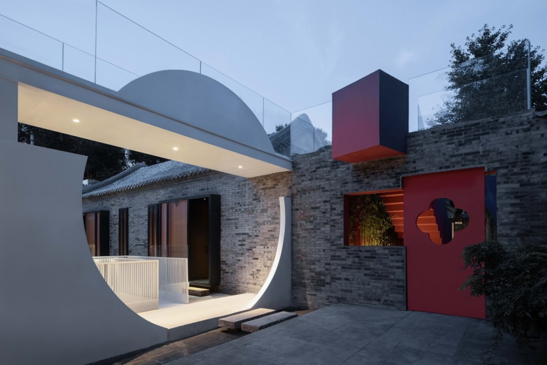 Modern house exterior with brick walls and metal accents.