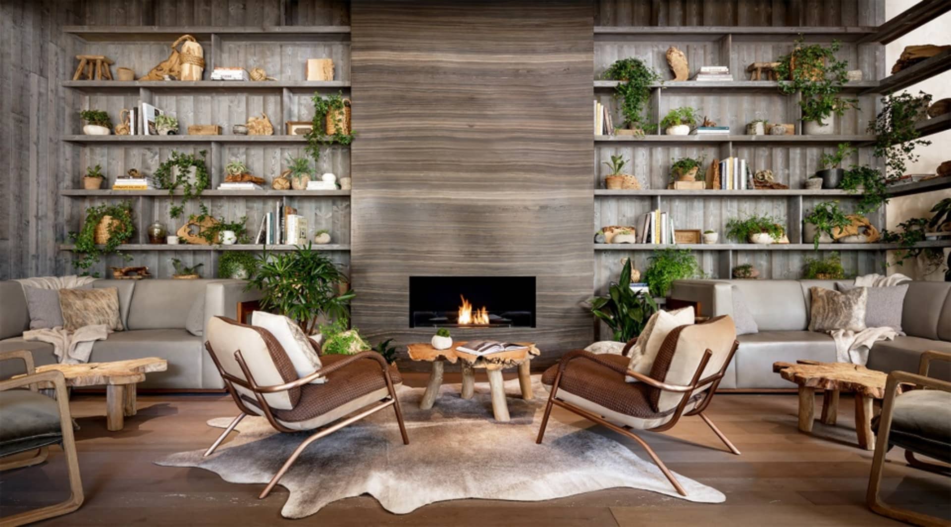 An industrial-style living room with wooden furniture and shelves.