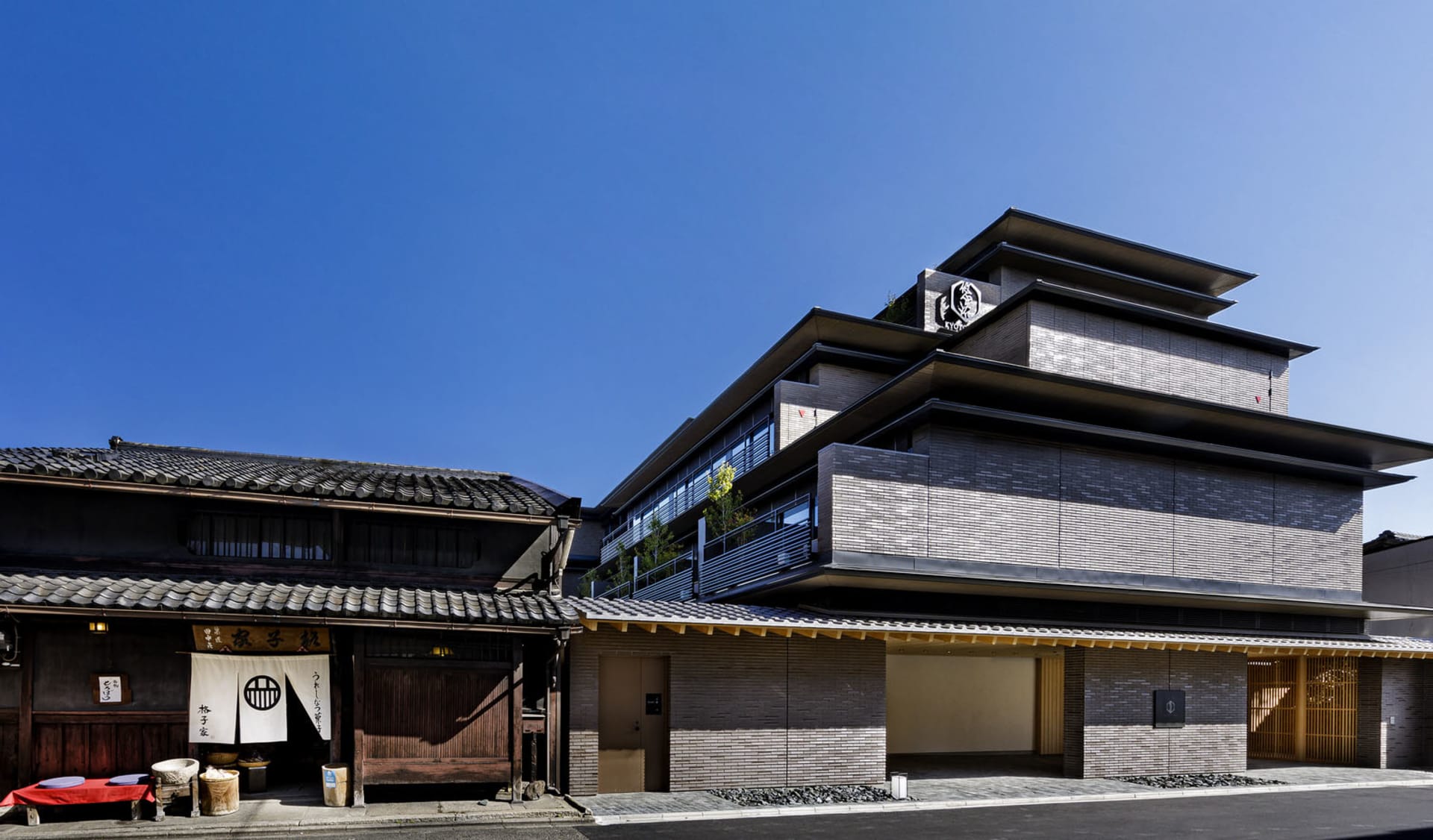 Modern industrial building exterior made of brick, concrete, and timber