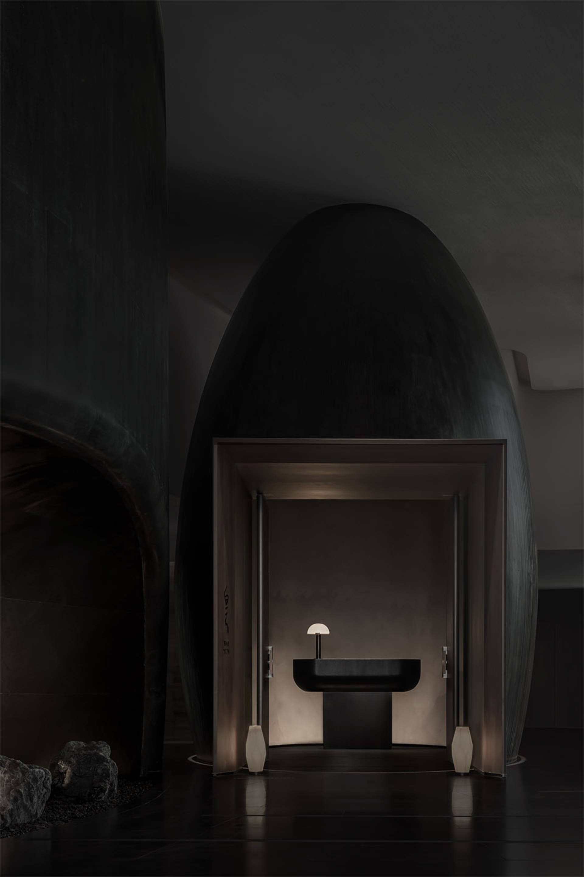 Modern bathroom with minimalist design featuring a concrete floor and walls.