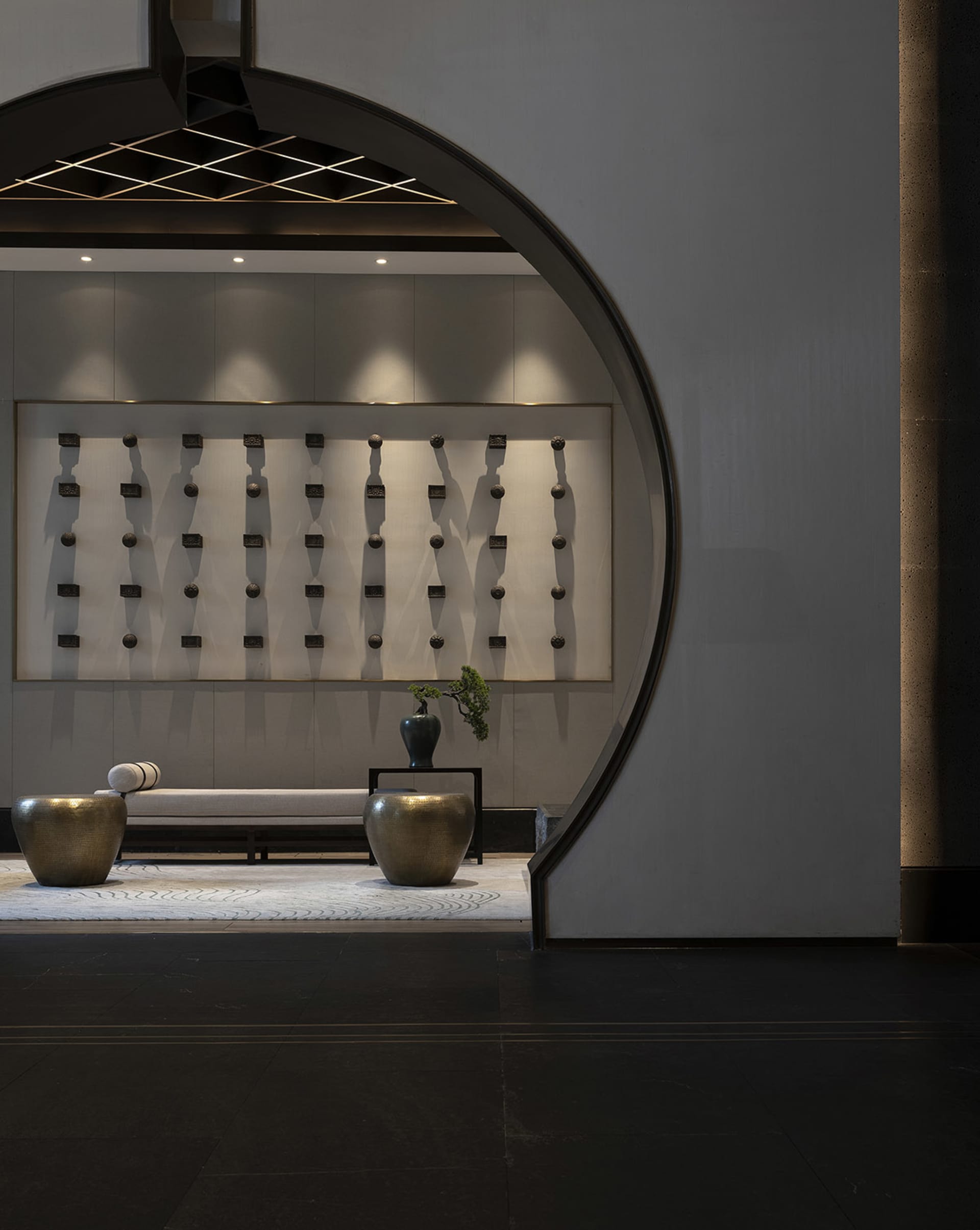 A modern lobby featuring metal and concrete elements.