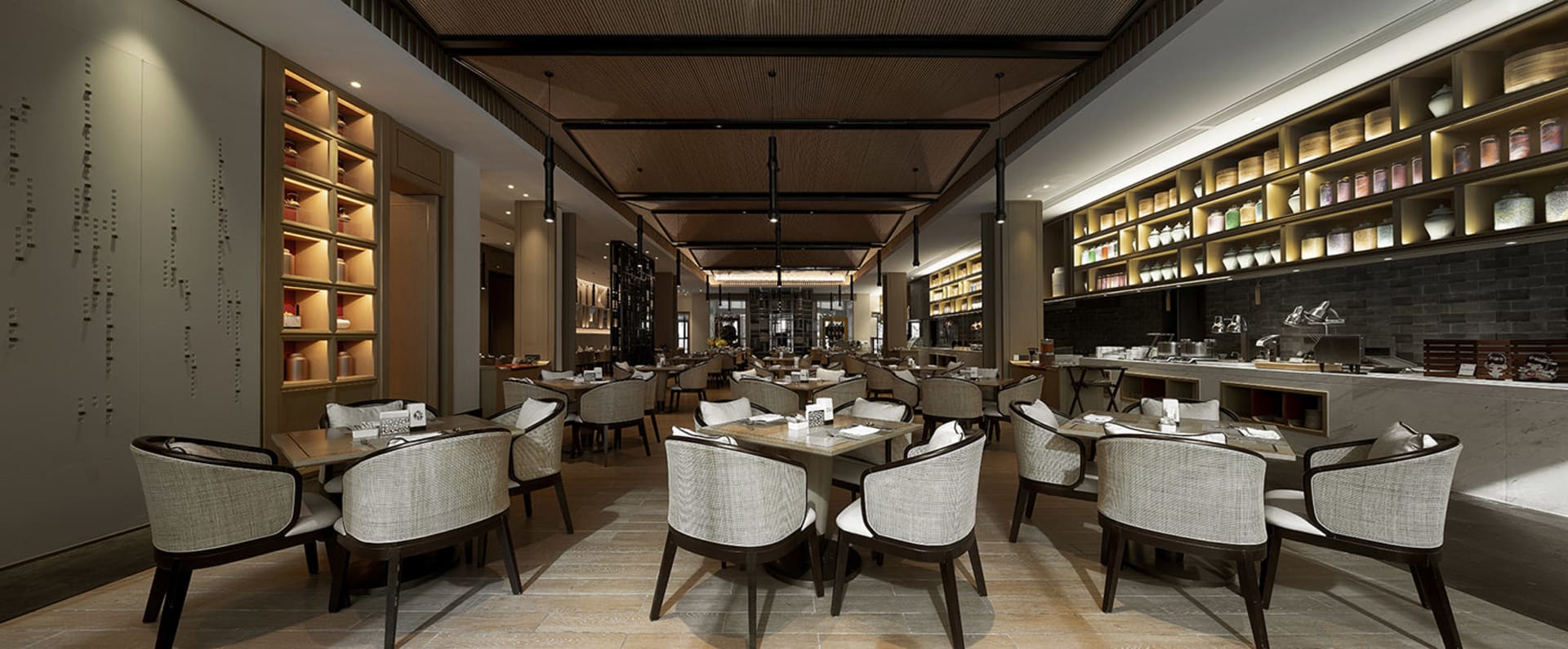 A modern restaurant with traditional design elements featuring neutral-toned tiles, white and beige seating, and wooden accen