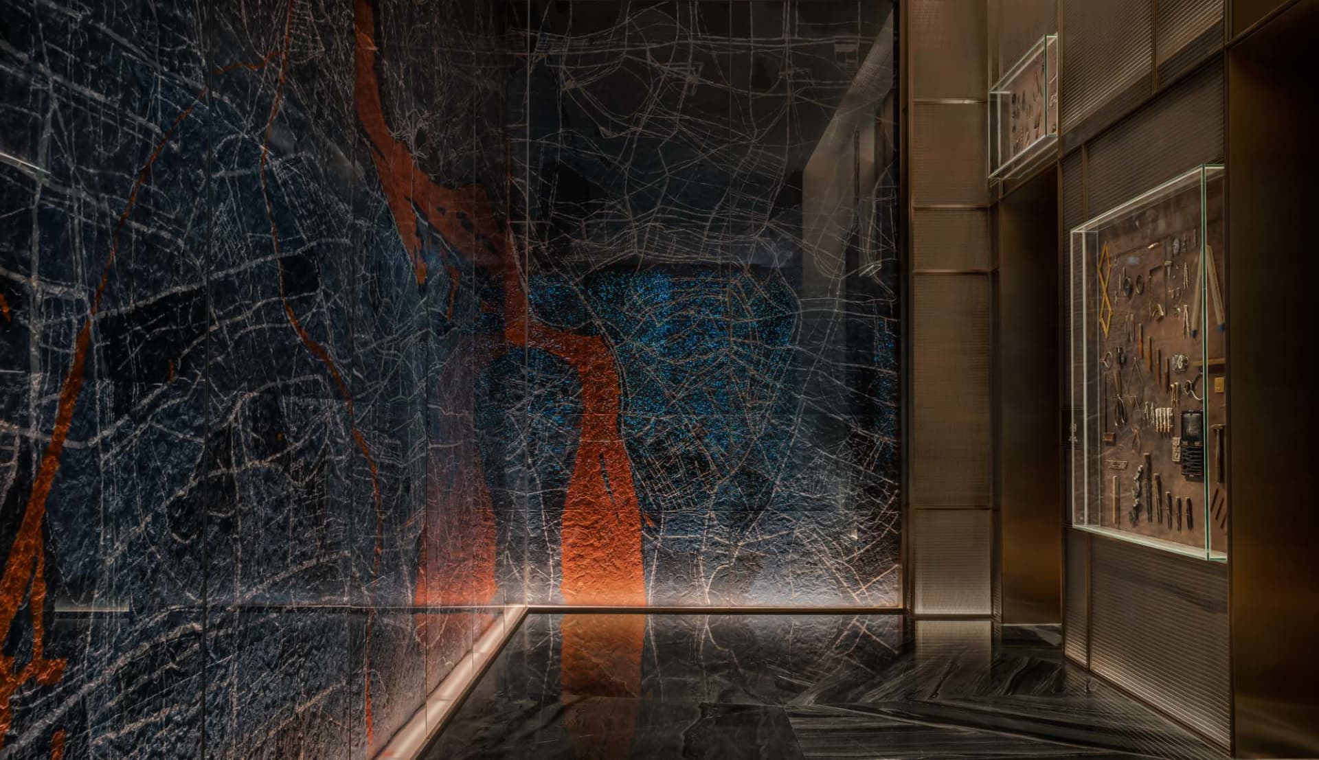 A sleek, contemporary hotel lobby featuring elegant marble design elements.