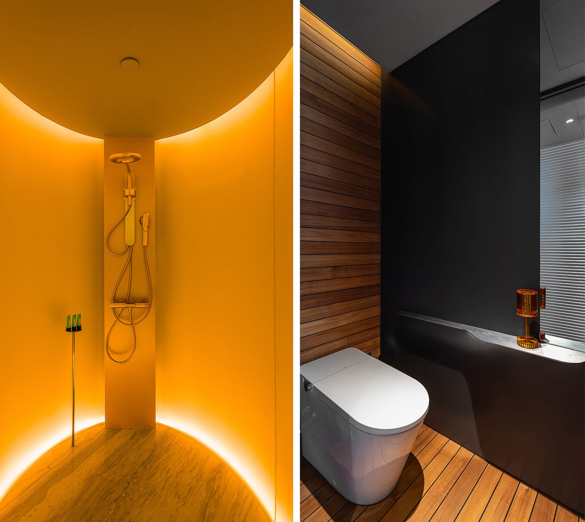 Modern bathroom featuring black and orange accents with dark walls and modern design elements.