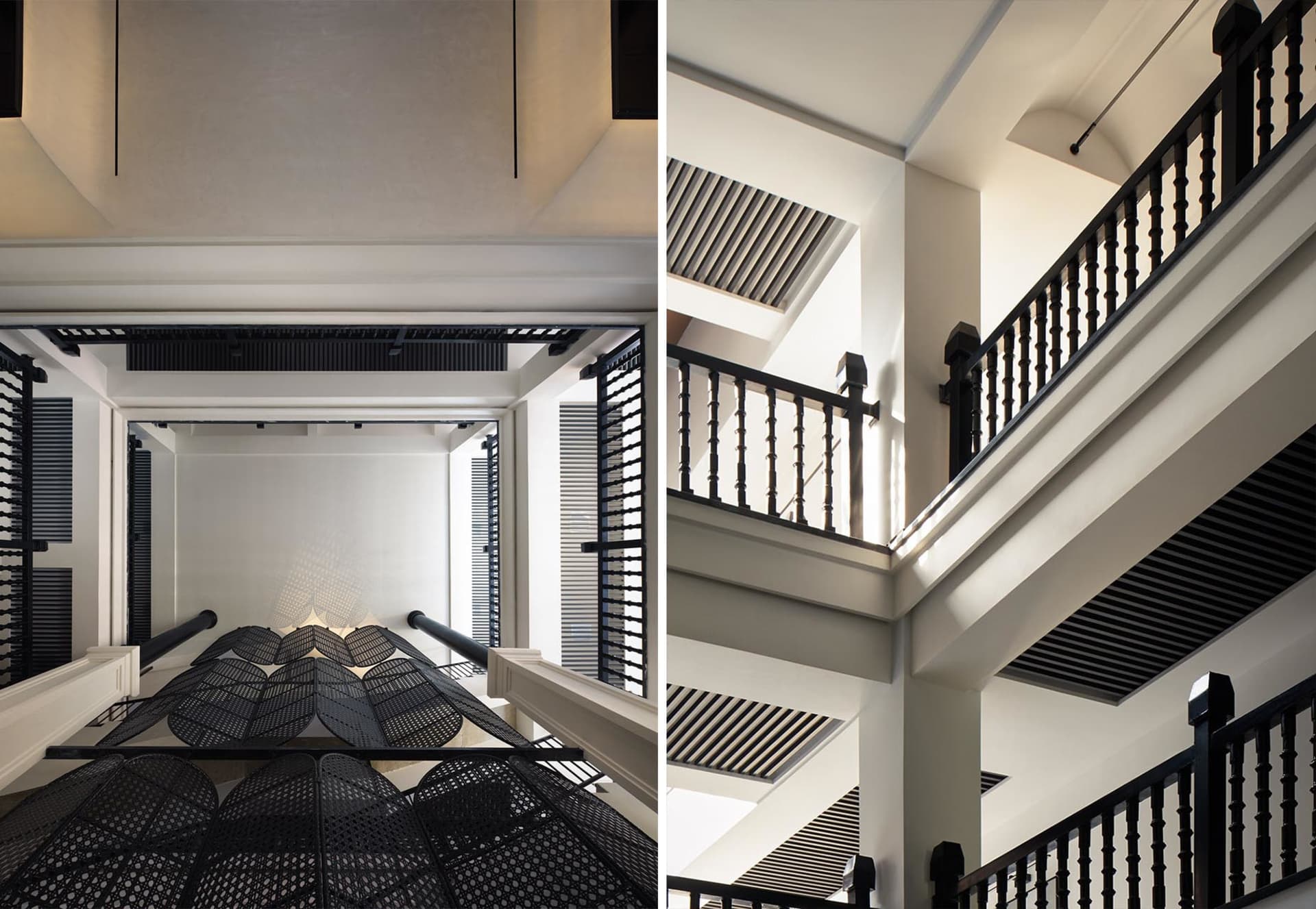 Modern, minimalist staircase with black metal railings and a geometric design.
