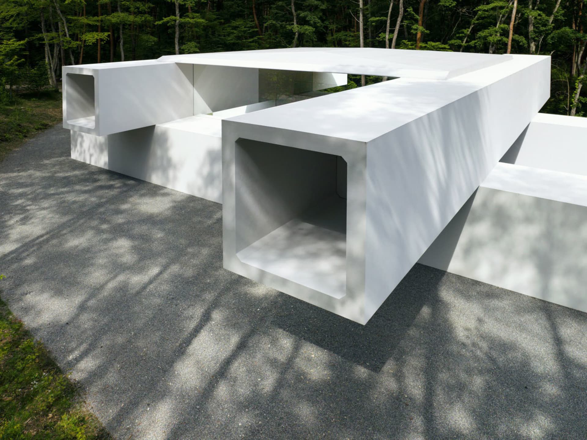 A minimalist concrete building with an open design.