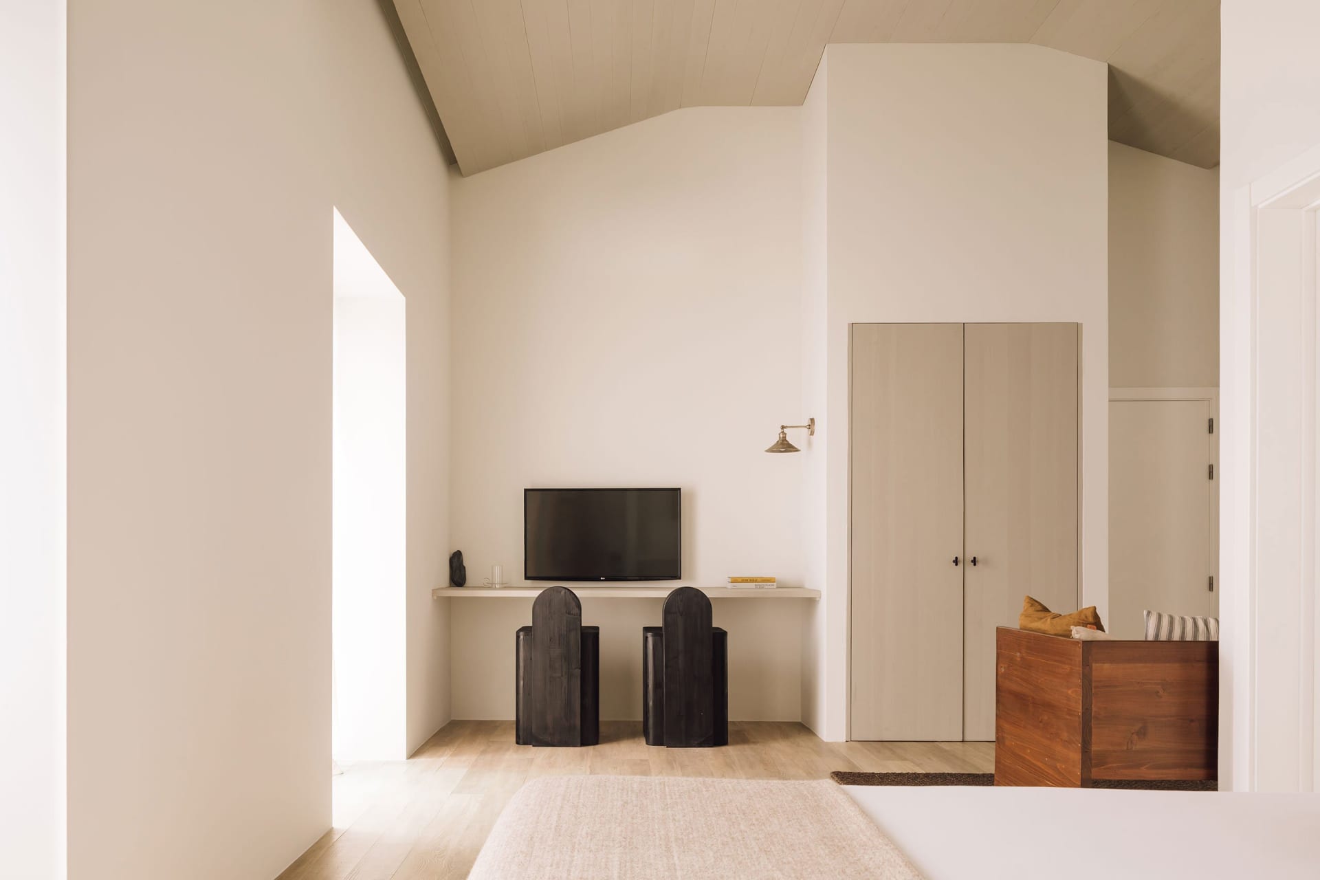 Modern minimalist living room featuring wood and metal accents.