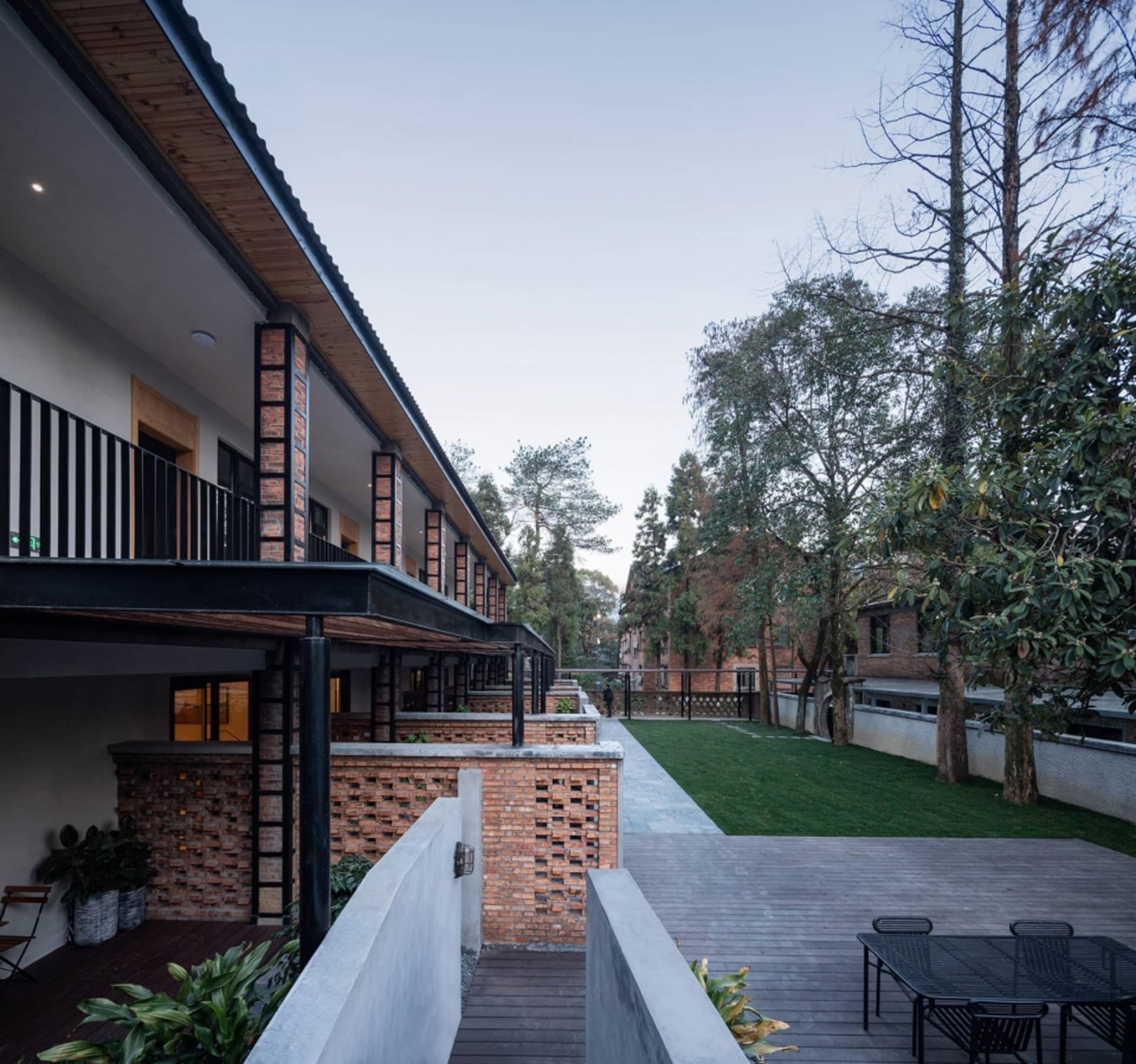 Modern residential exterior featuring brick and wood materials.