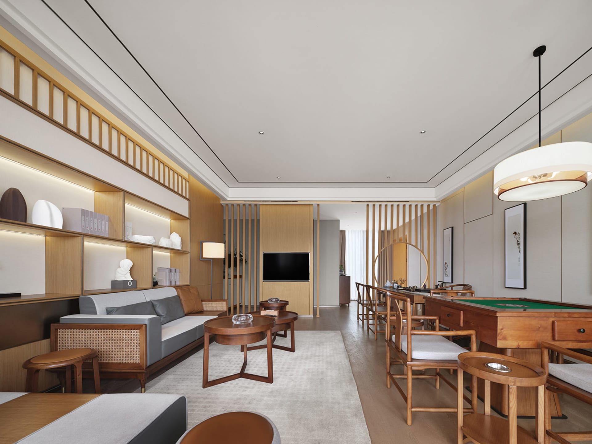 A modern living and dining room featuring wooden furniture and decor.