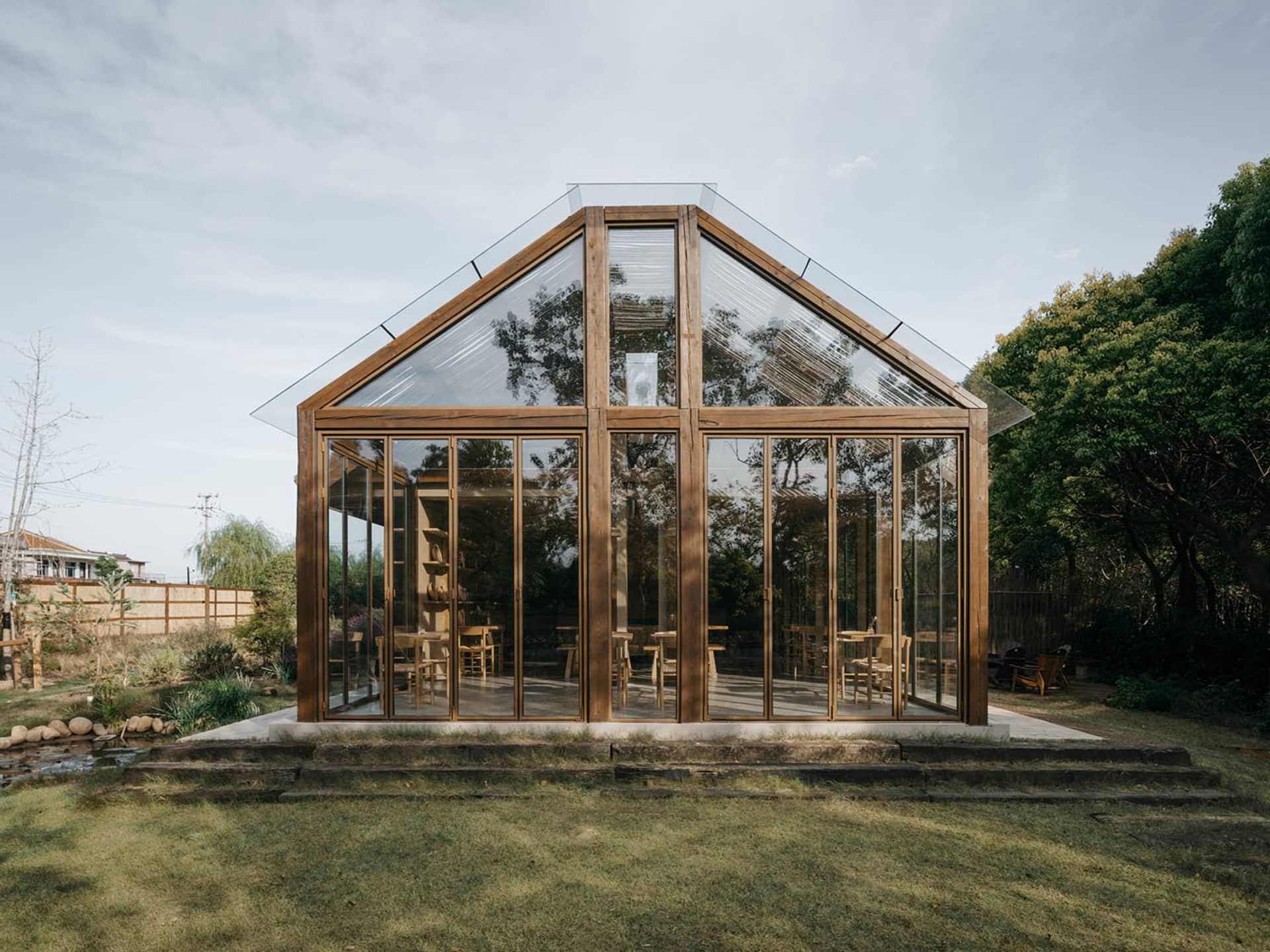 A modern residential exterior featuring wood materials