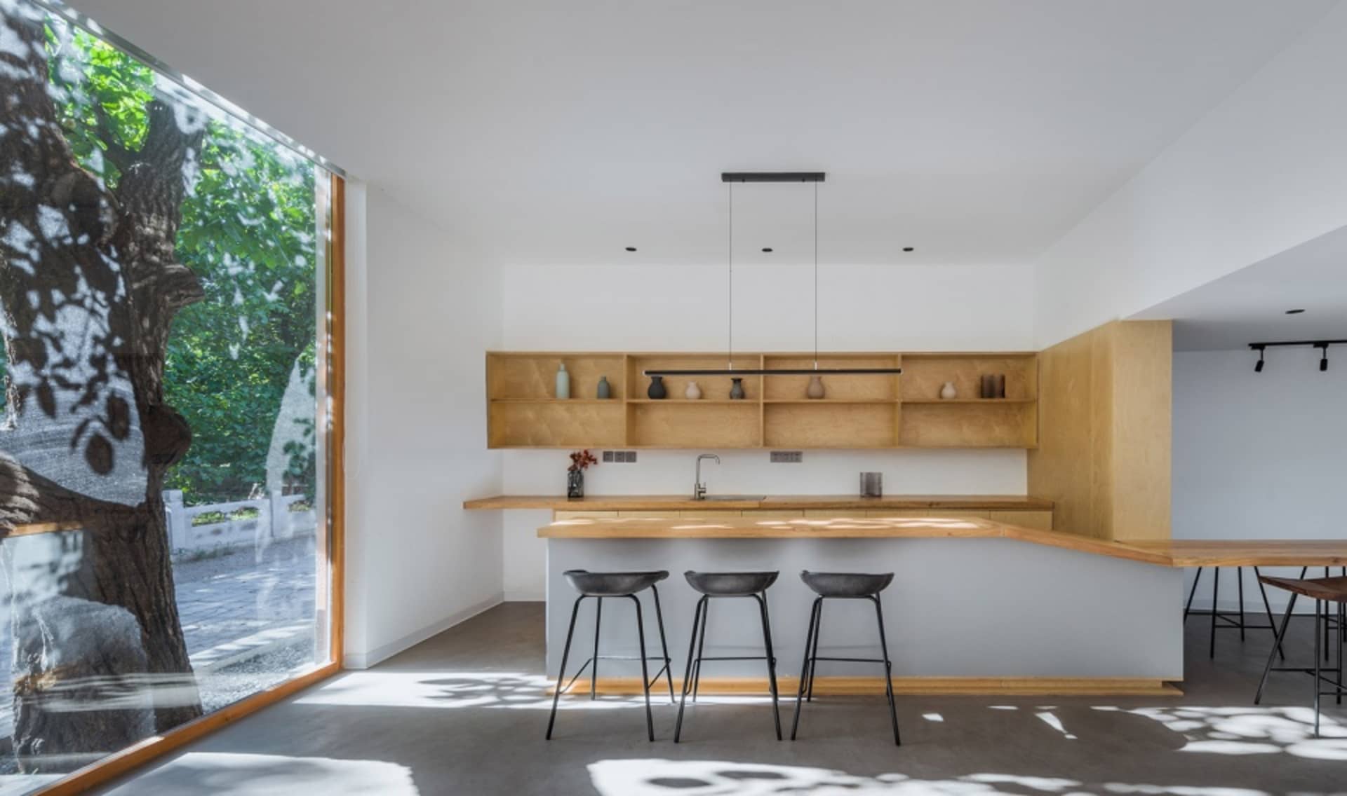 Modern kitchen with minimalist design and wooden finishes