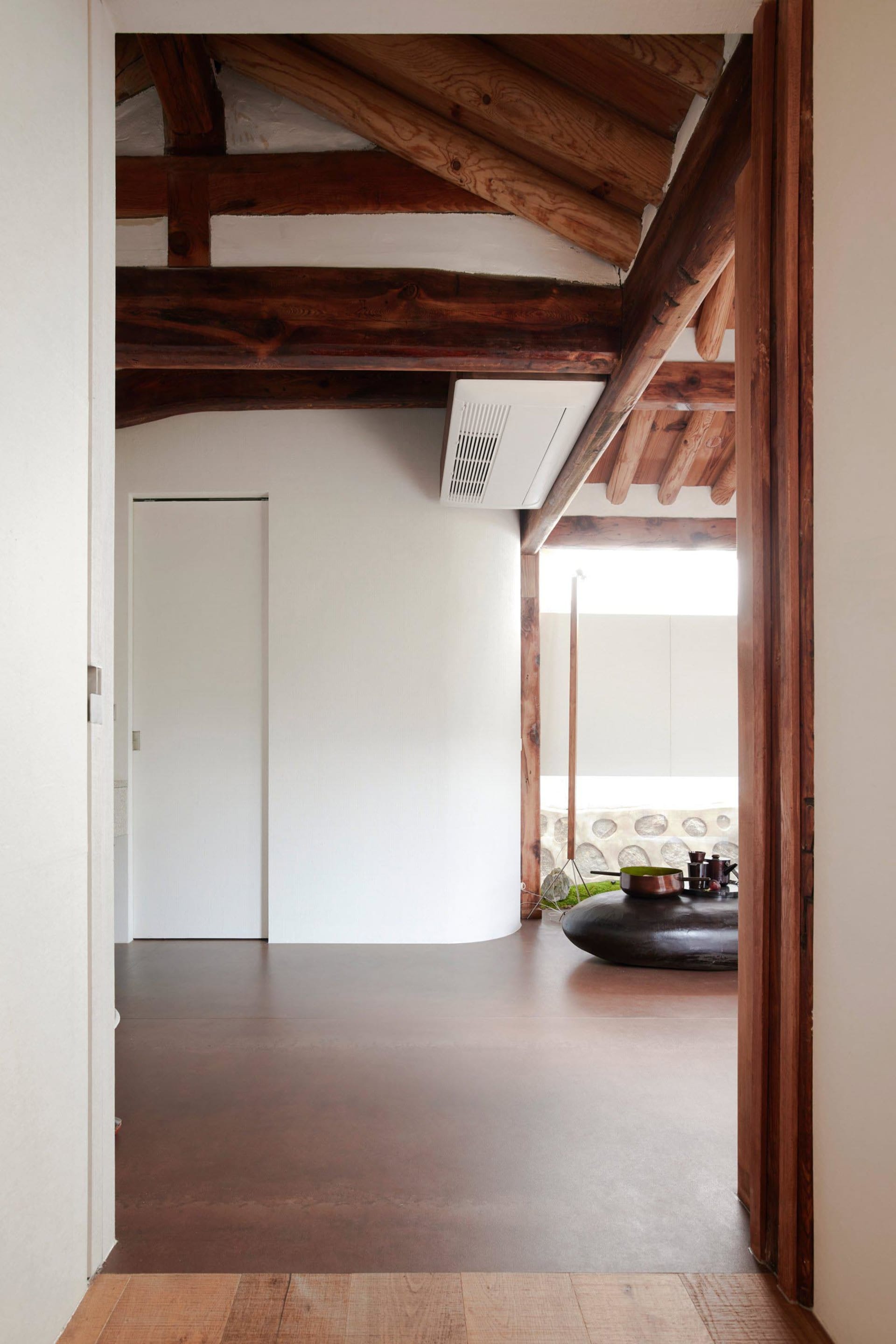 Modern minimalist living room with concrete and wood elements