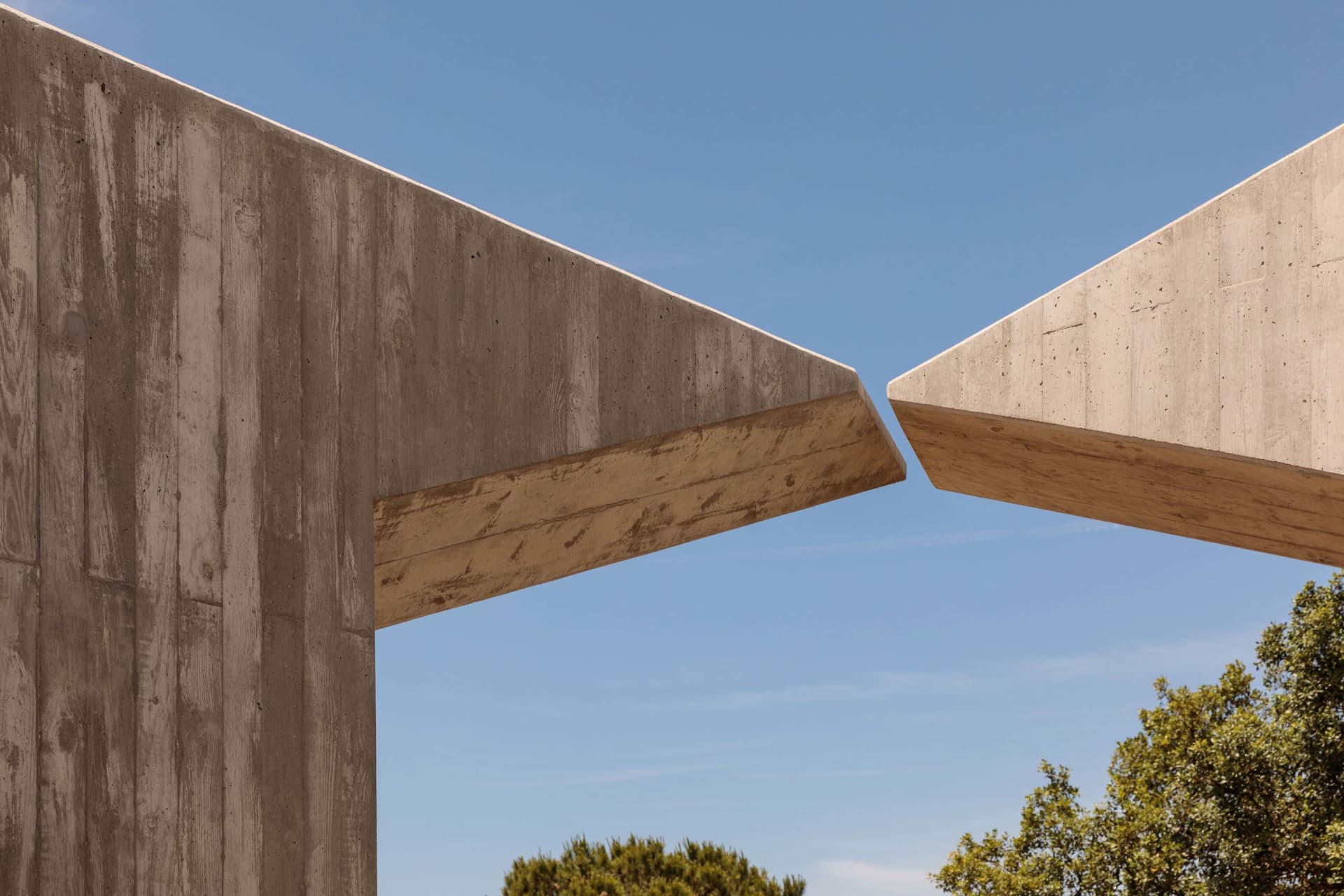Concrete architectural structure with overlapping elements.