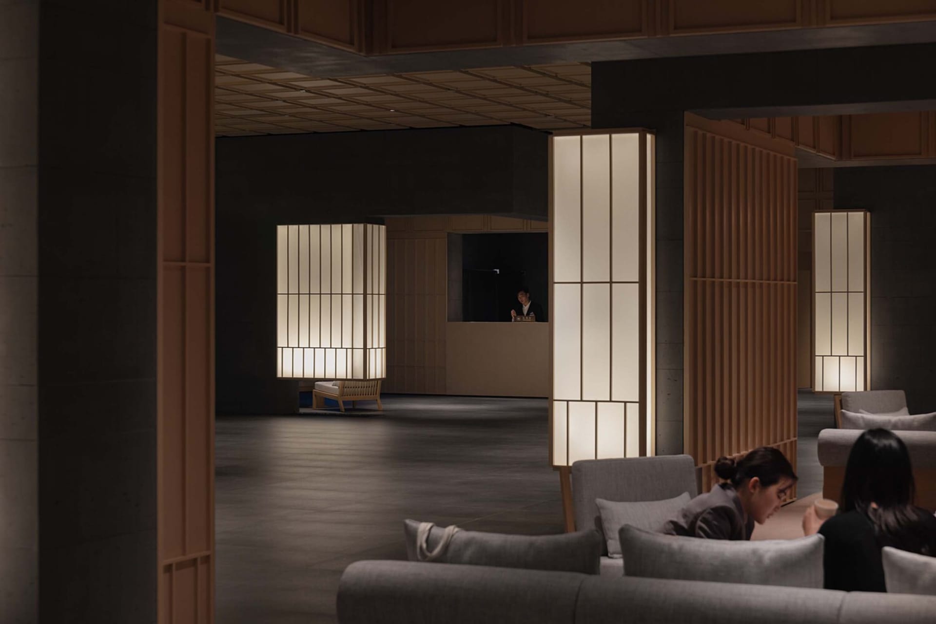 Modern hotel lobby featuring contemporary furniture and lighting.
