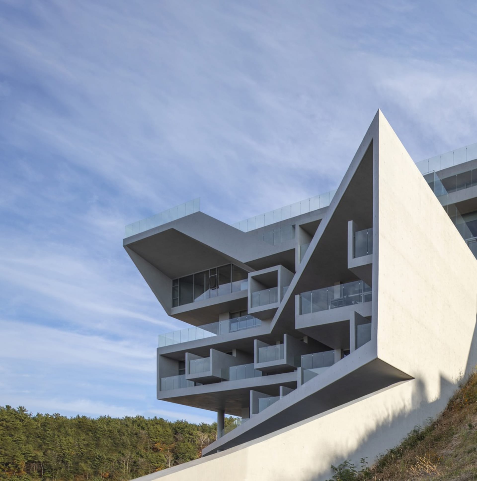 Exterior view of a modern, concrete, angular building.