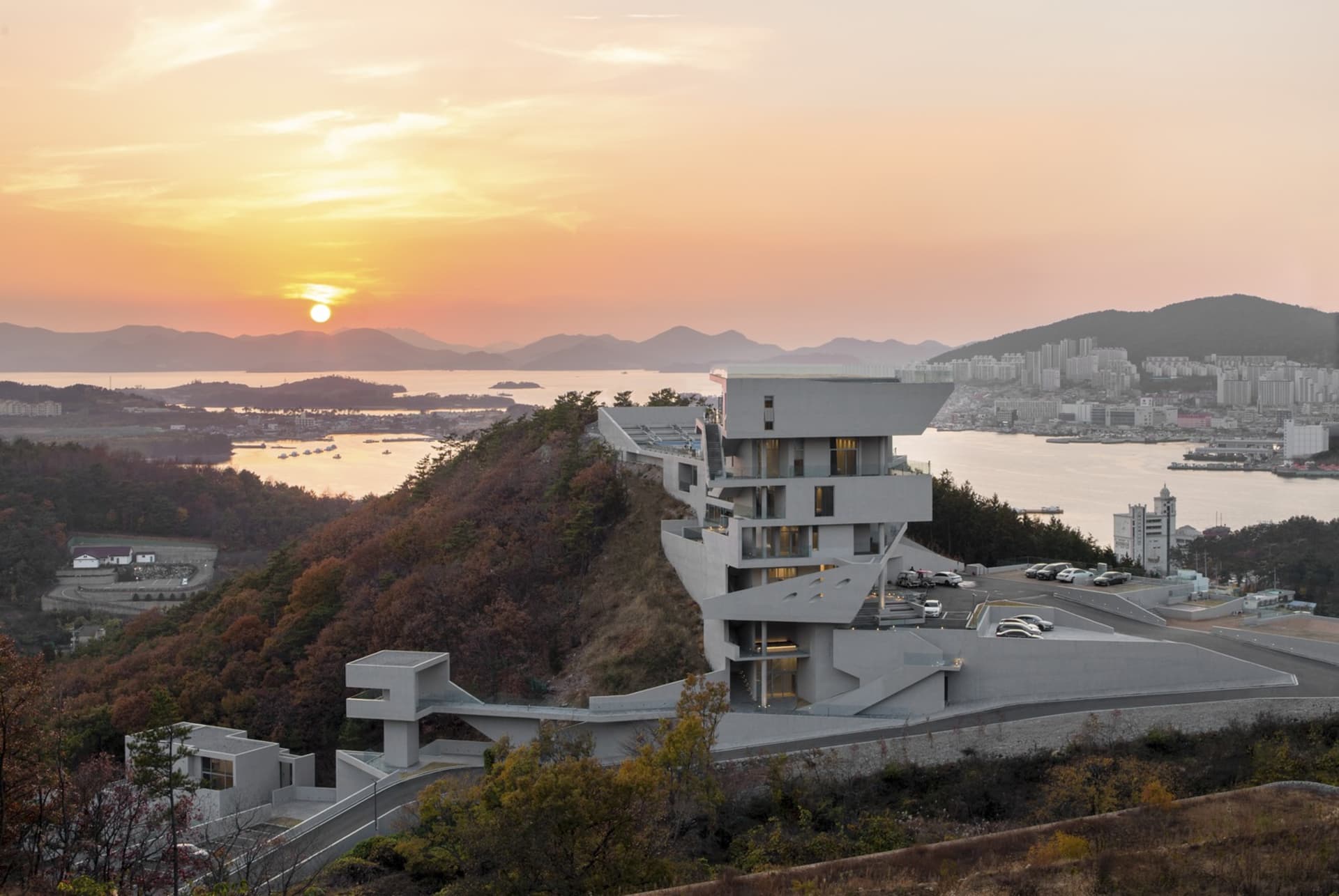 Modern residential building on a hillside constructed with concrete.