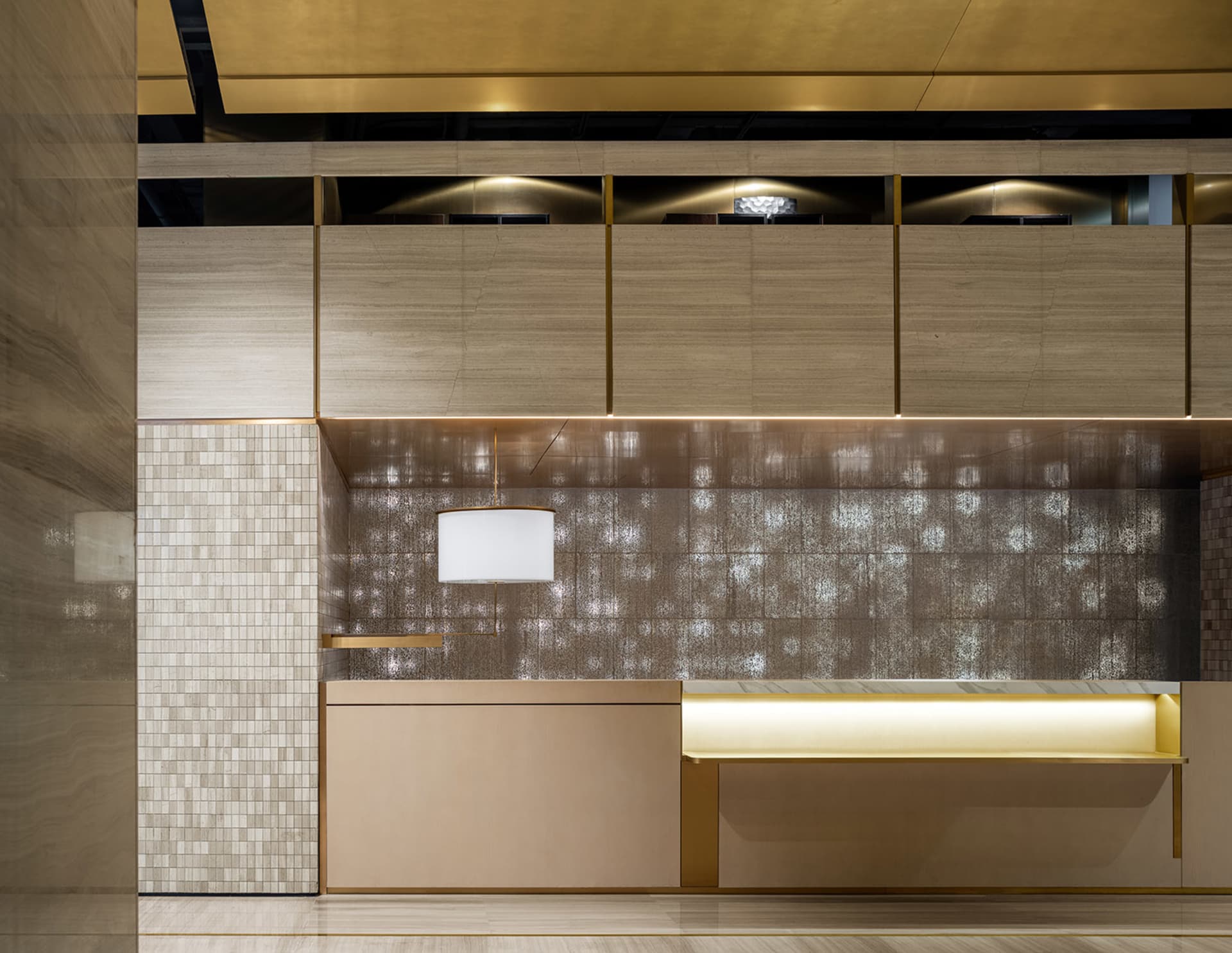 Modern interior of a hotel reception featuring wood and terrazzo materials.