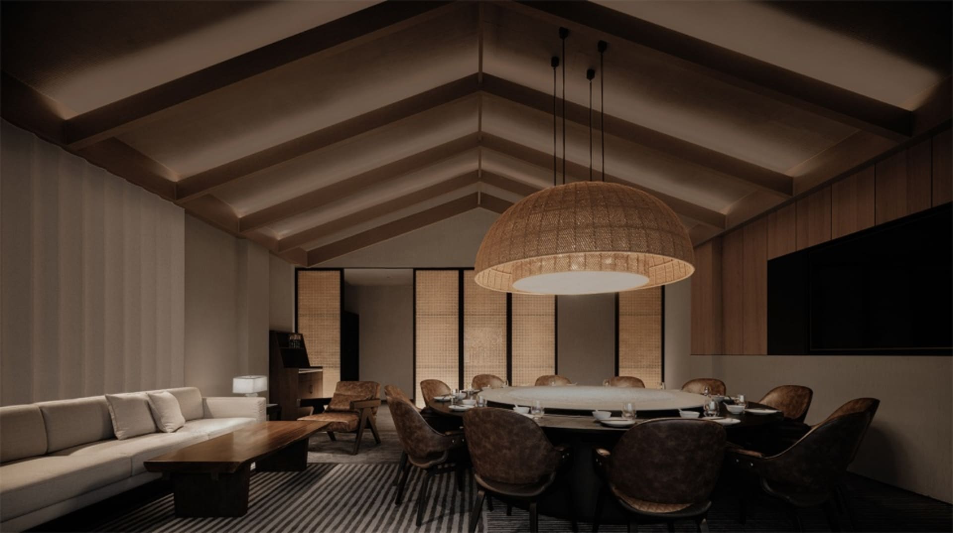 Industrial-style lounge and dining area featuring wood furniture and decorative woven lighting.