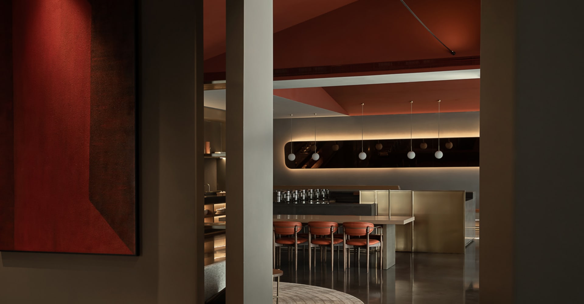 Modern, metallic bar with sleek, minimalist design.