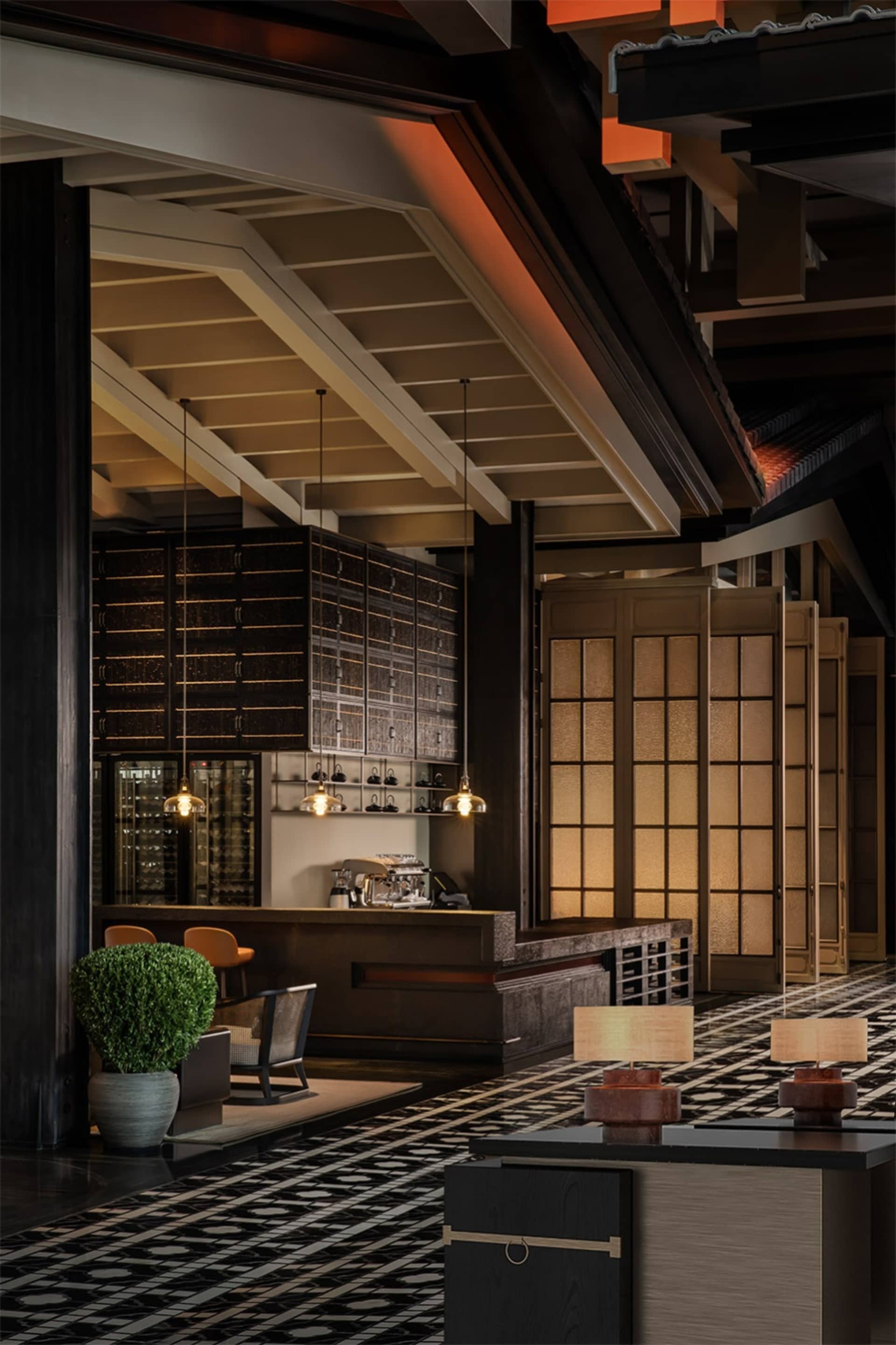 Industrial-themed restaurant with metal, wood, and glass materials