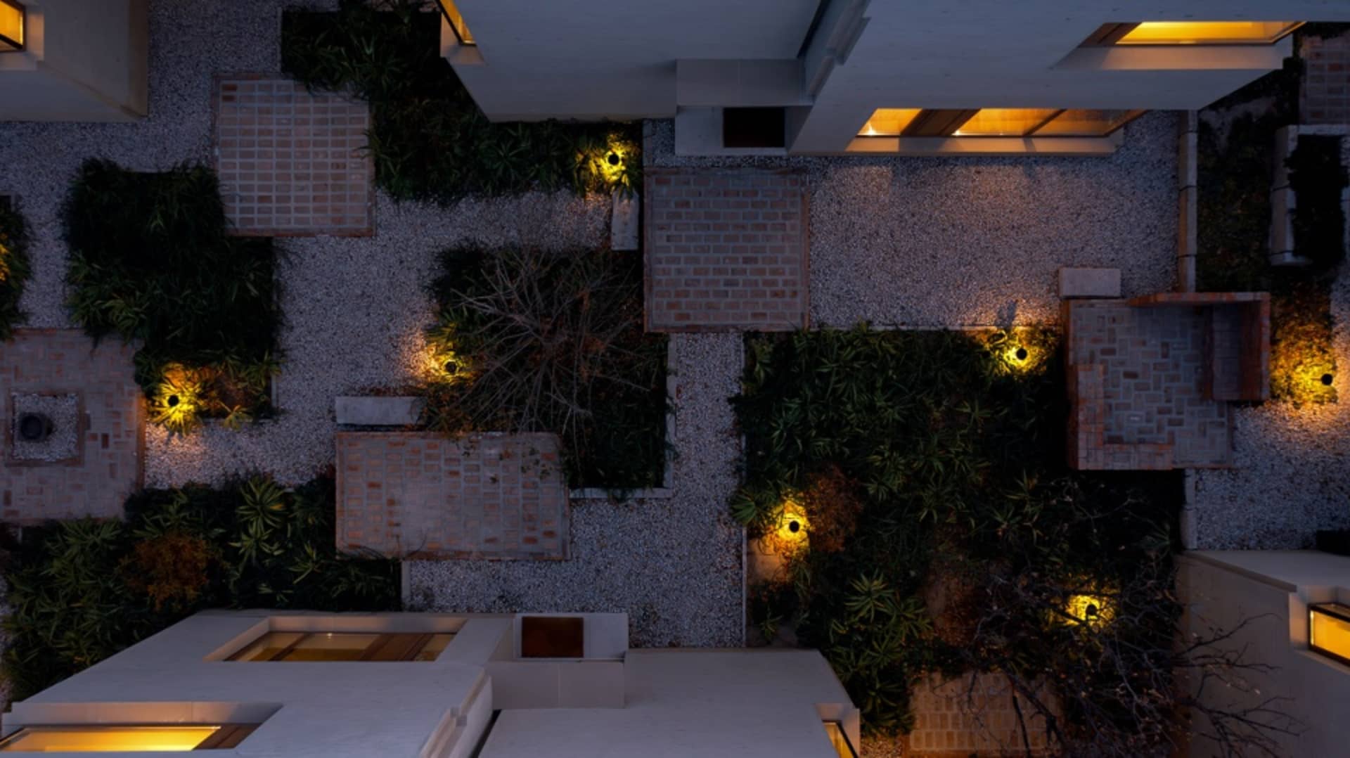 Top view of a modern industrial living space with concrete walls and floor.