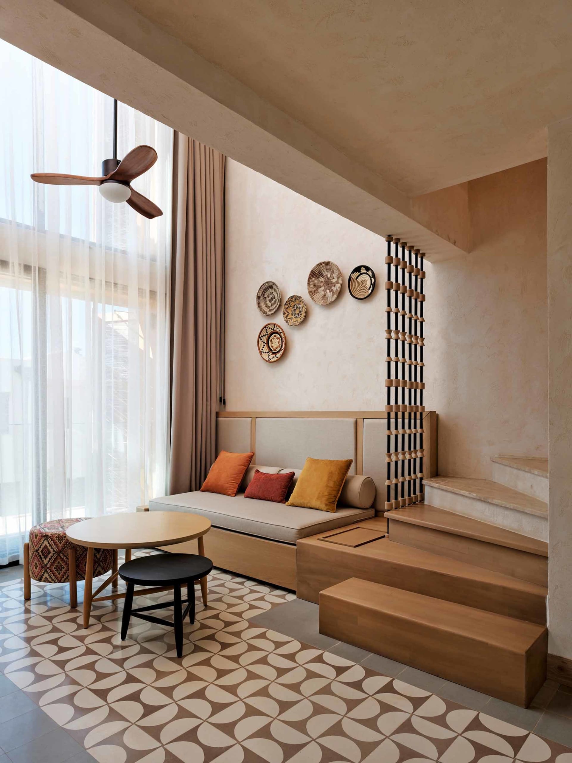 Modern living room with wooden furniture and decorative elements.