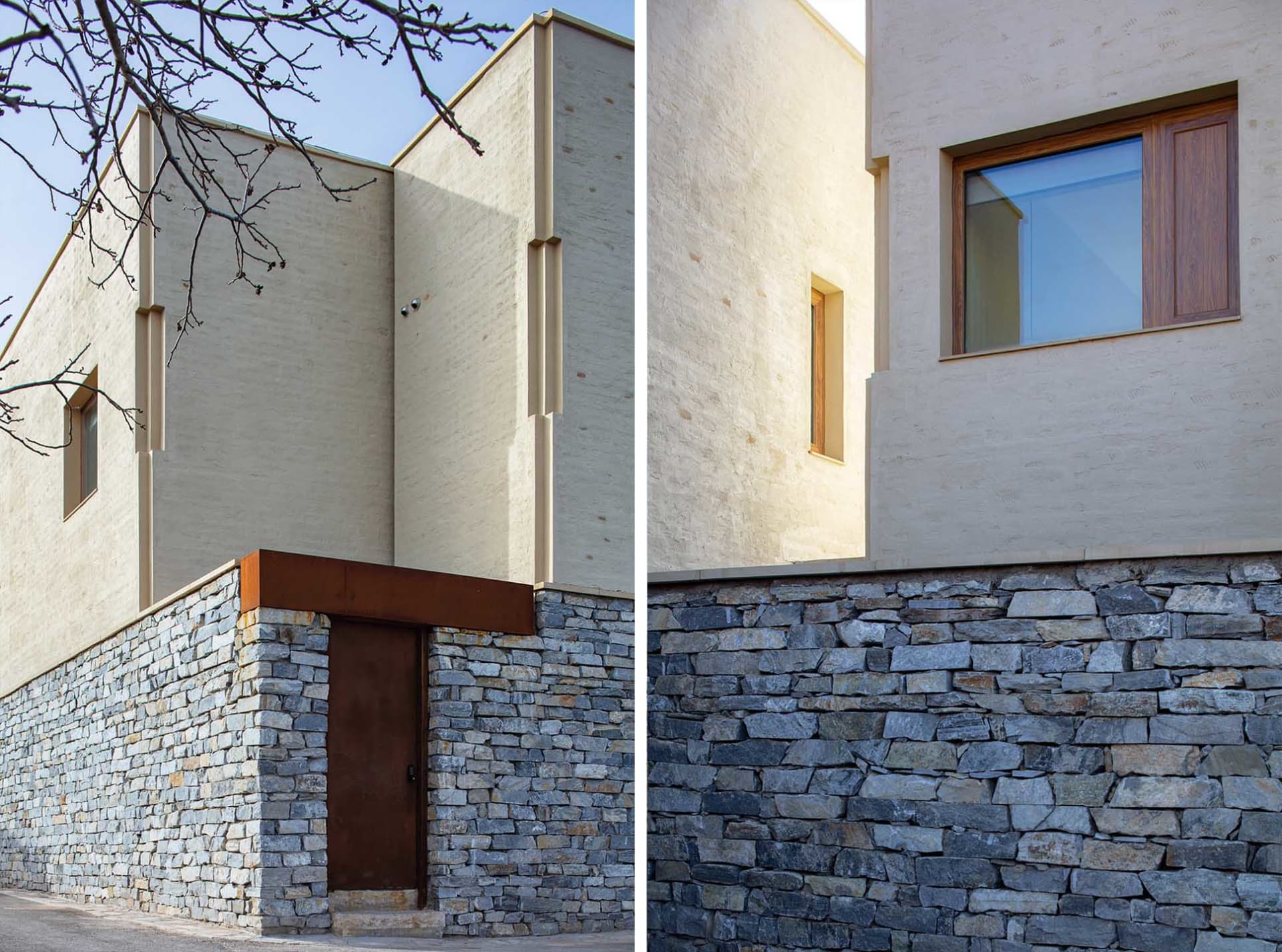 Modern house exterior featuring a stone foundation and stucco walls.