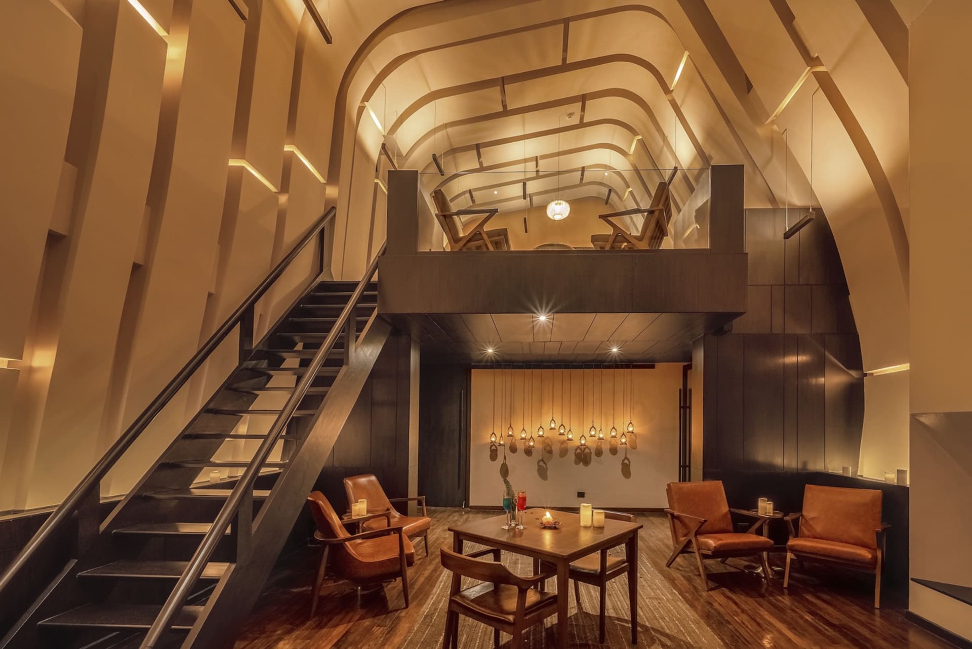 Industrial-style restaurant interior with wooden furniture and exposed ceiling beams.