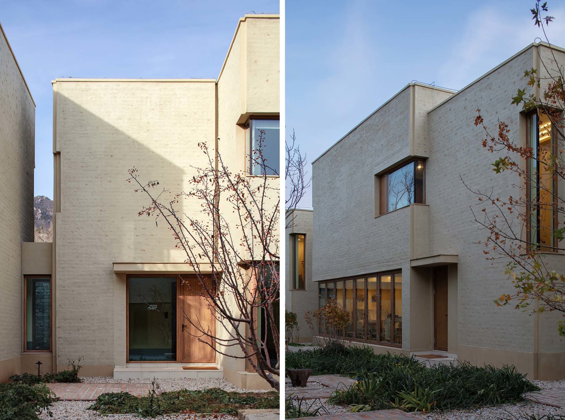 Modern house with concrete exterior and large windows.