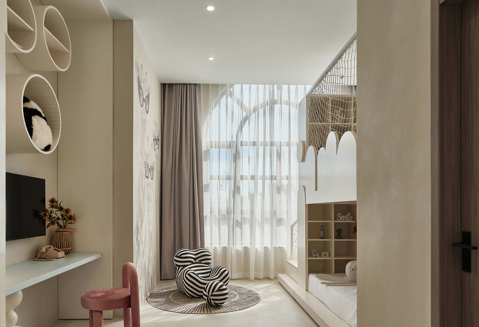 A modern bedroom featuring white walls, a white chair with black and white stripes, and a white bunk bed with circular shelve