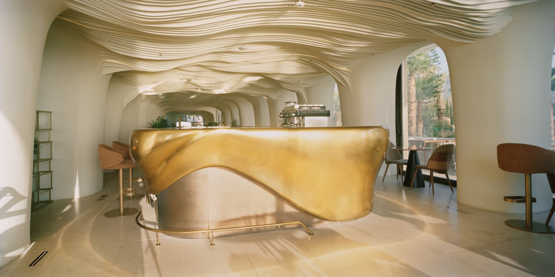 A modern coffee shop featuring a metallic counter design