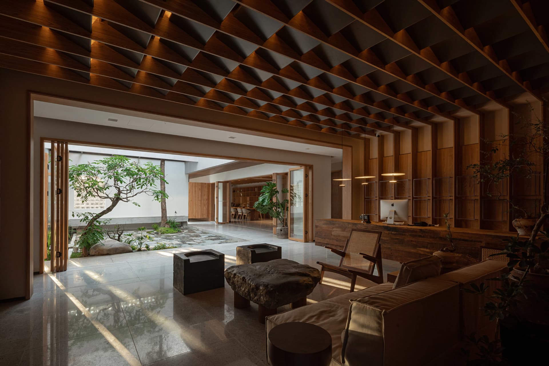Modern living room featuring wooden furniture and a stone coffee table.