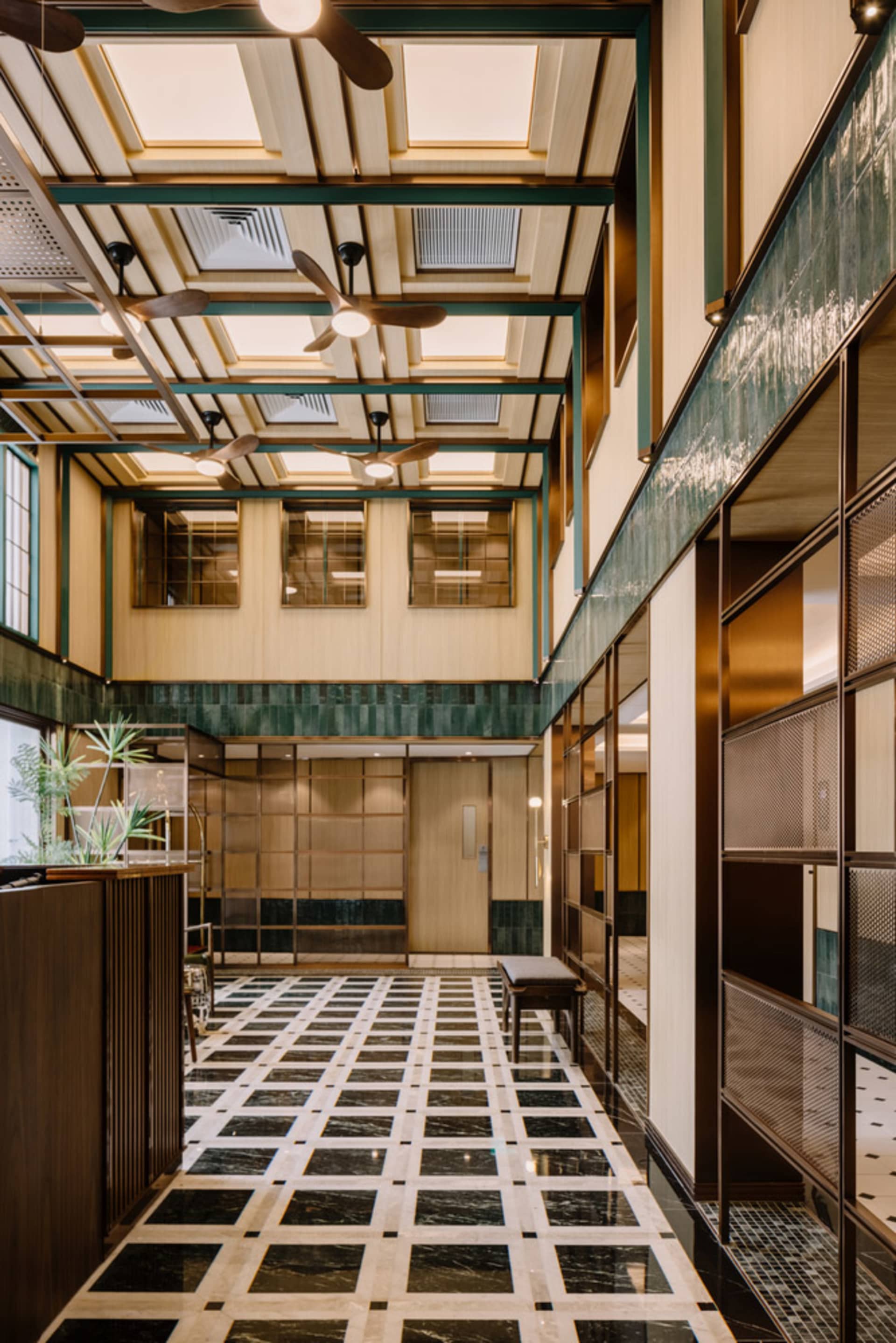 A contemporary lobby space with marble flooring and modern design elements.