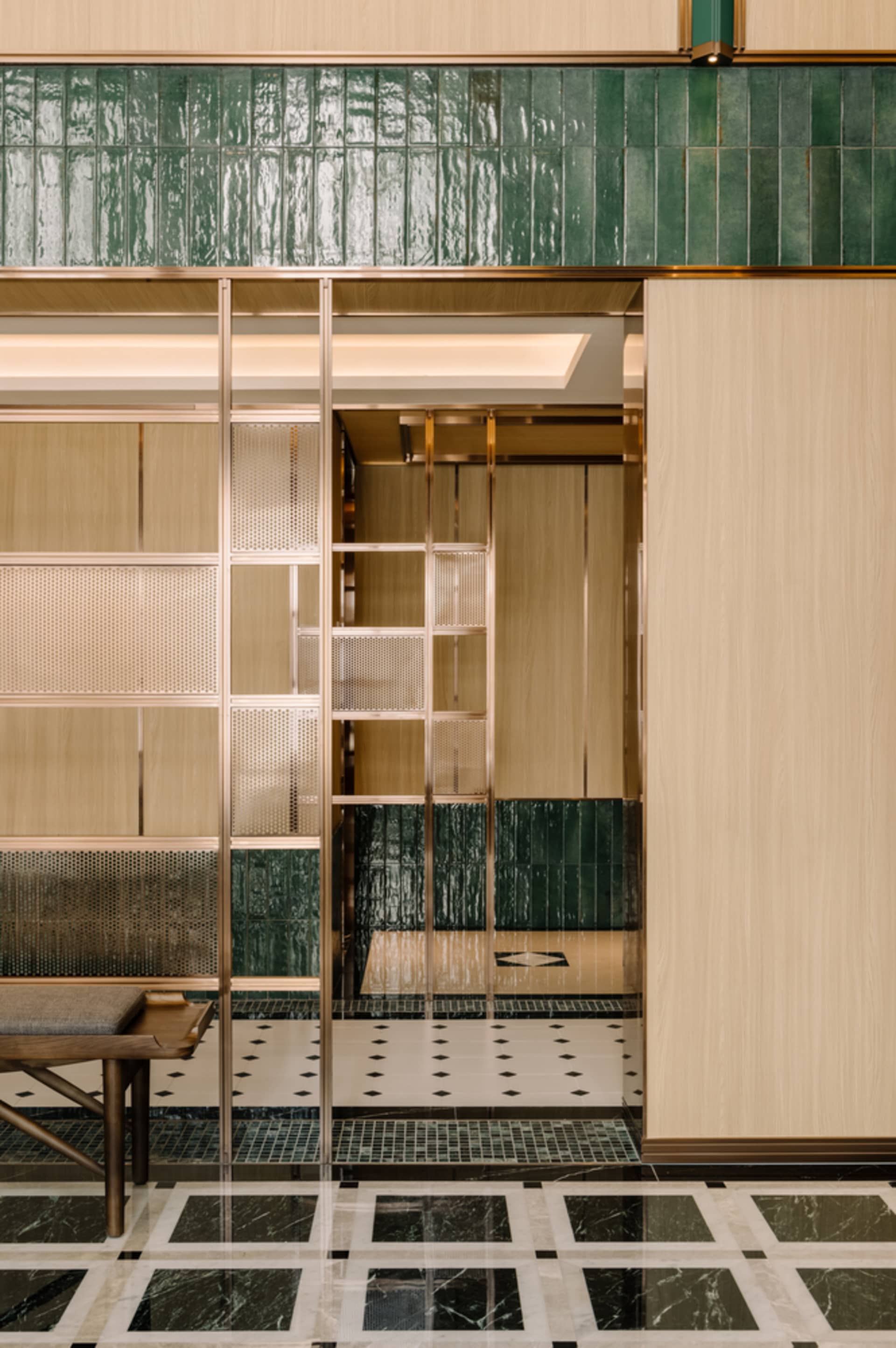 Modern retail storefront with a metal perforated panel facade