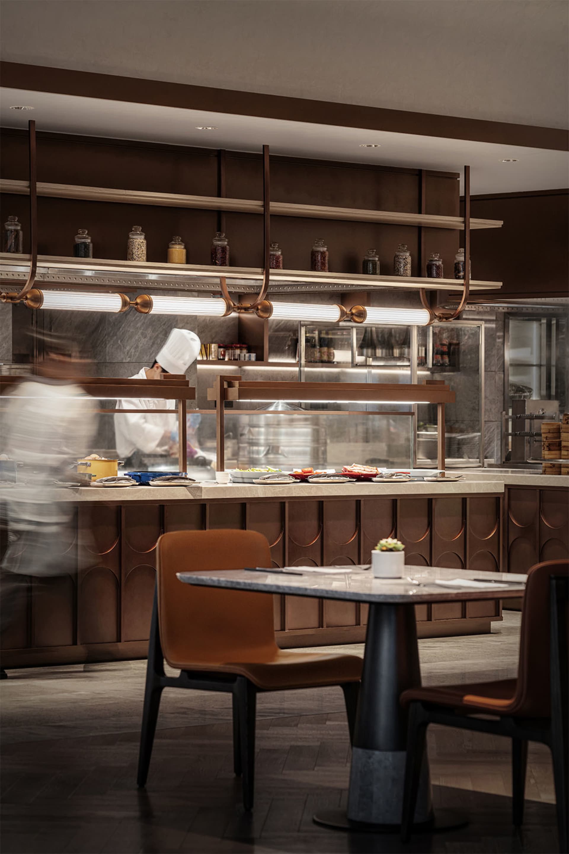 Modern industrial kitchen with wooden counter and marble backsplash