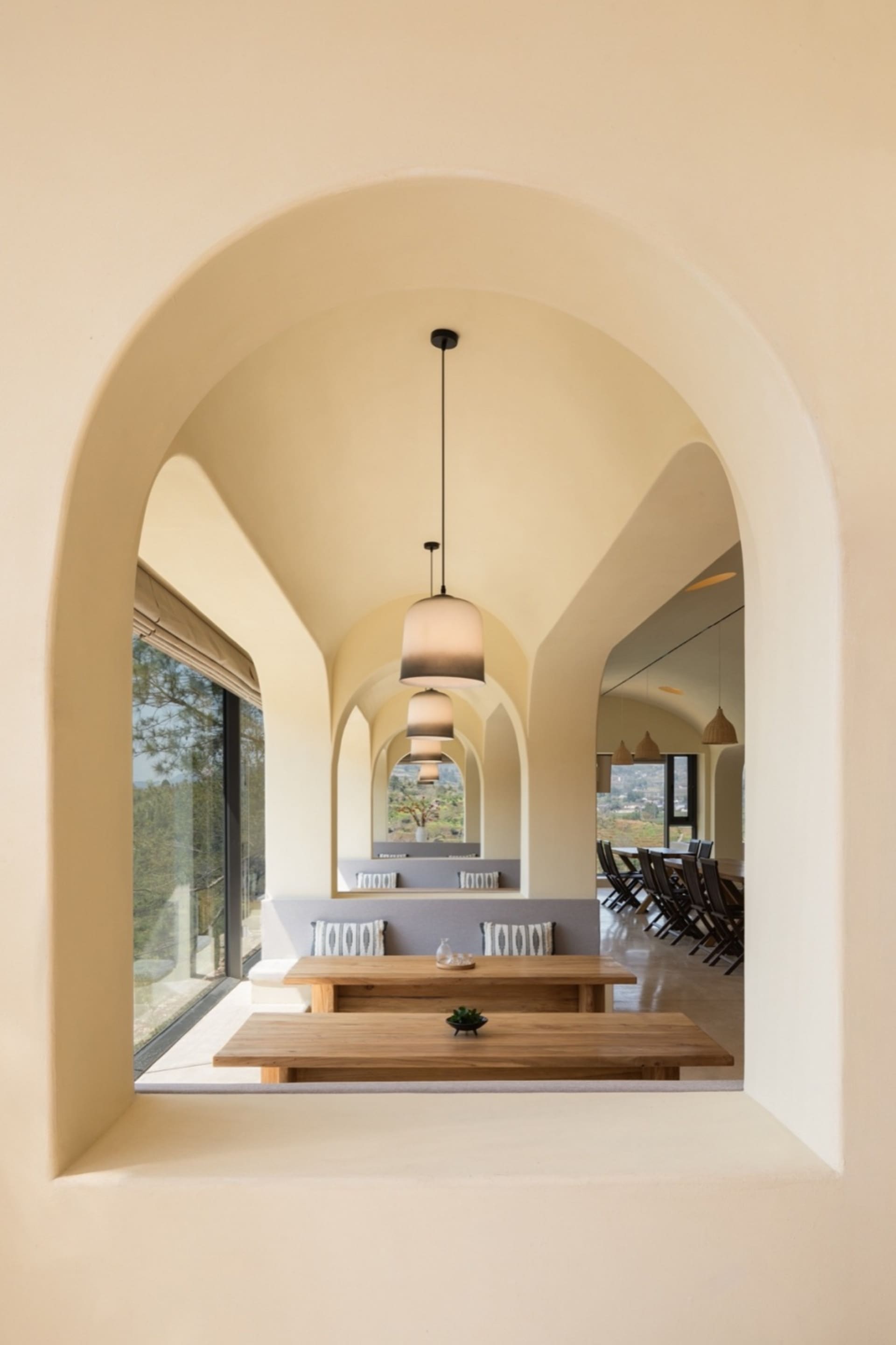 Modern minimalist restaurant interior with wooden tables and benches