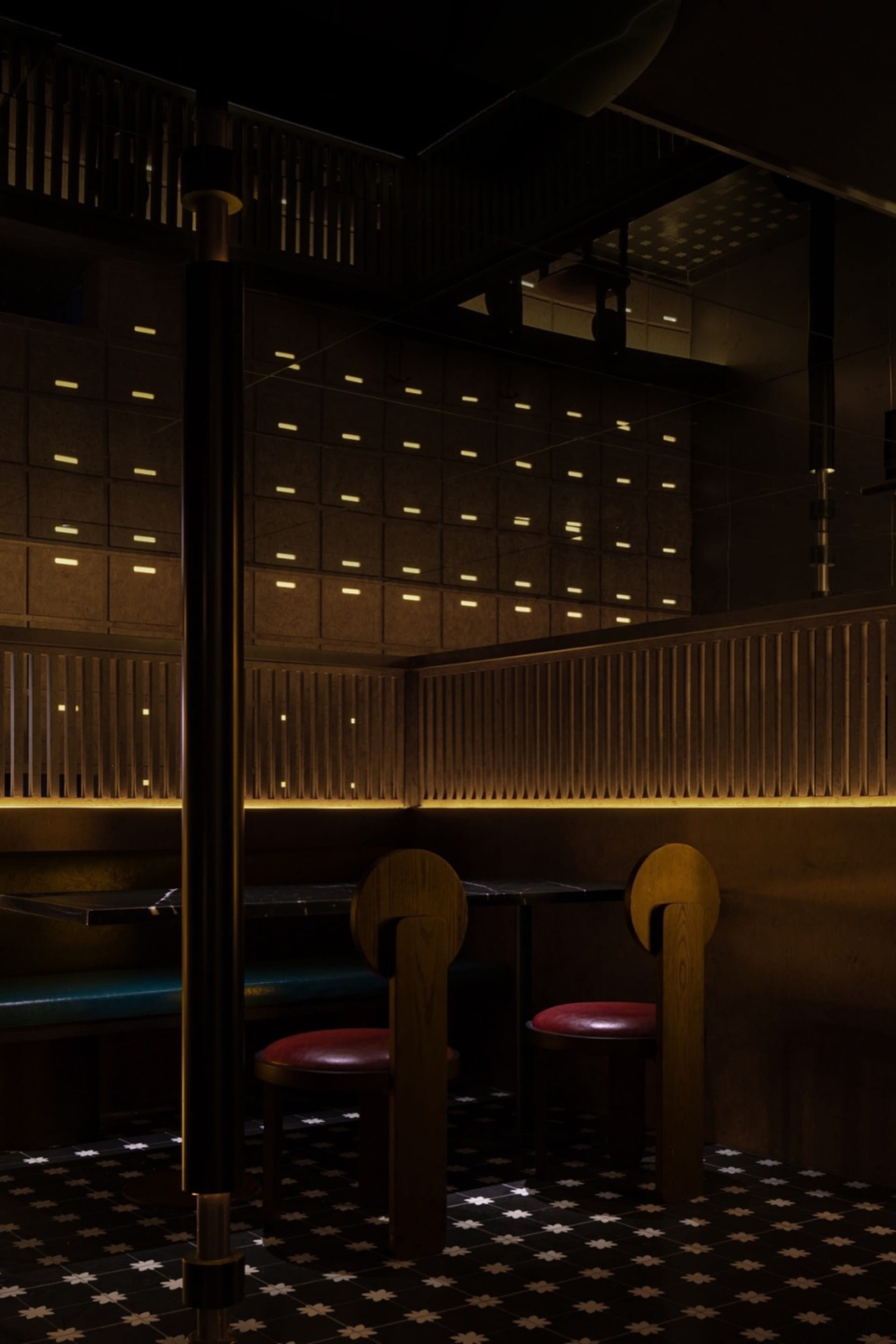 A modern industrial restaurant interior with wooden furniture and lighting.