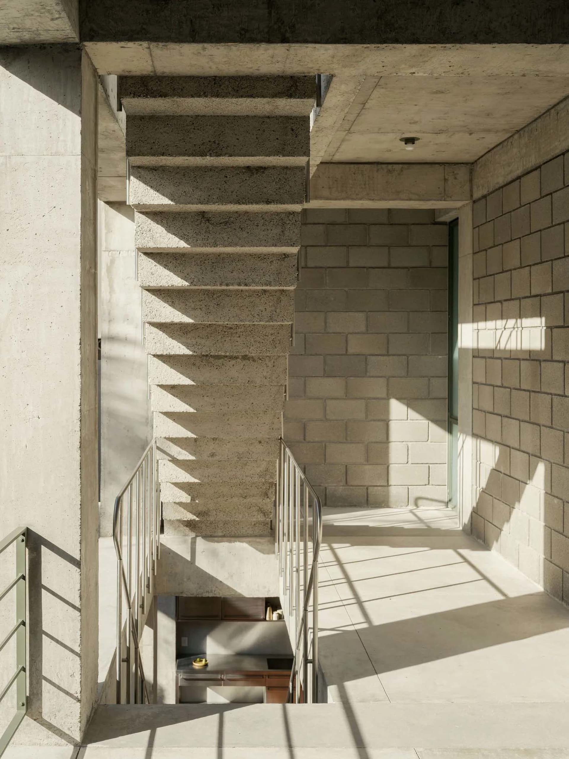 Modern indoor staircase constructed of concrete.