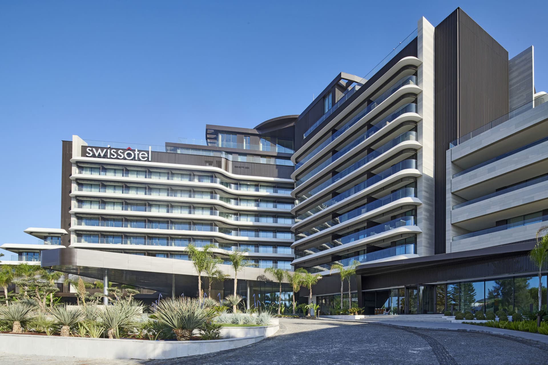 A modern building with glass and concrete exterior features
