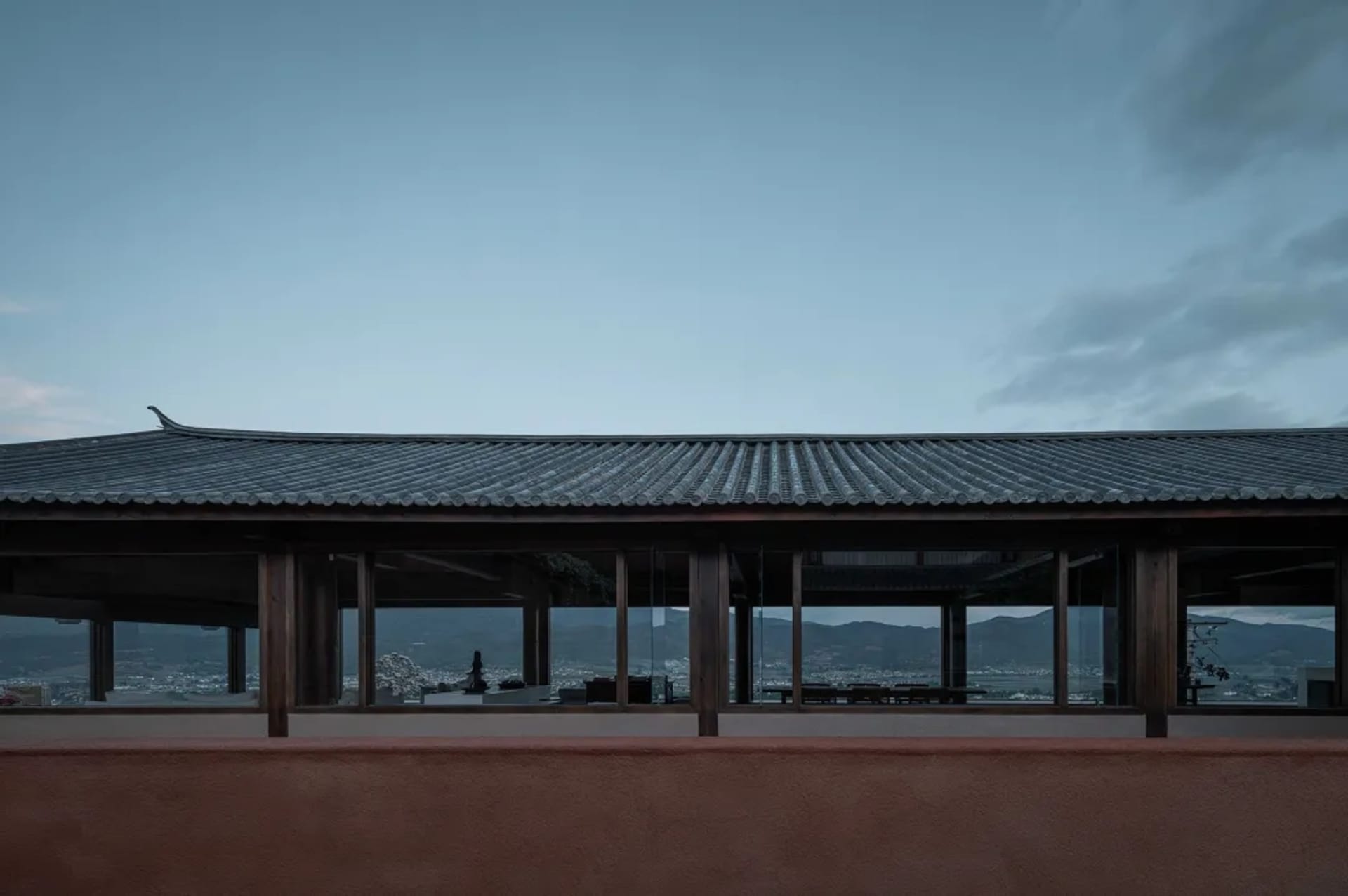 The image depicts the exterior roofline of a traditional building with a terrazzo roof.