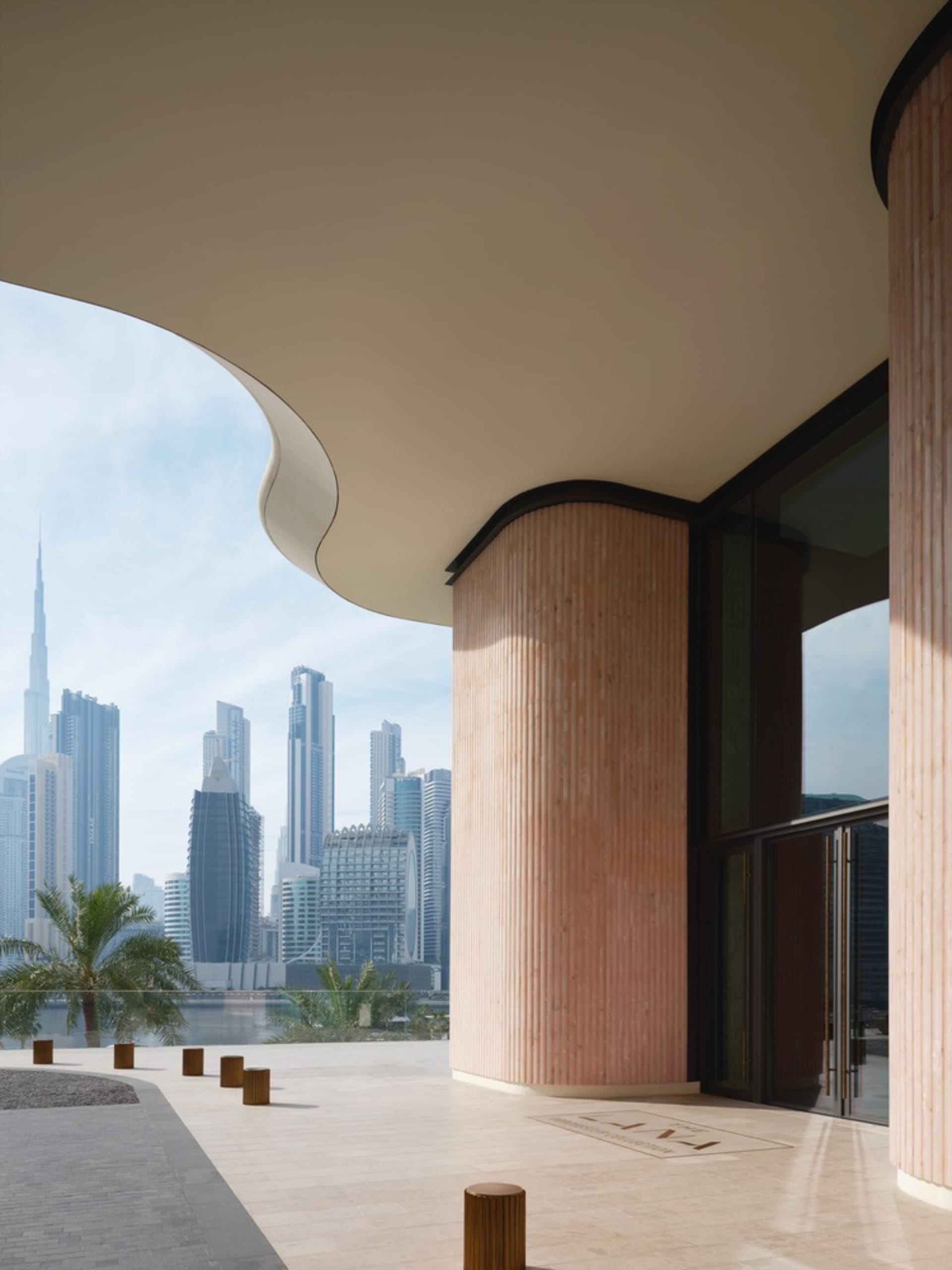 Modern hotel lobby featuring a concrete and glass design