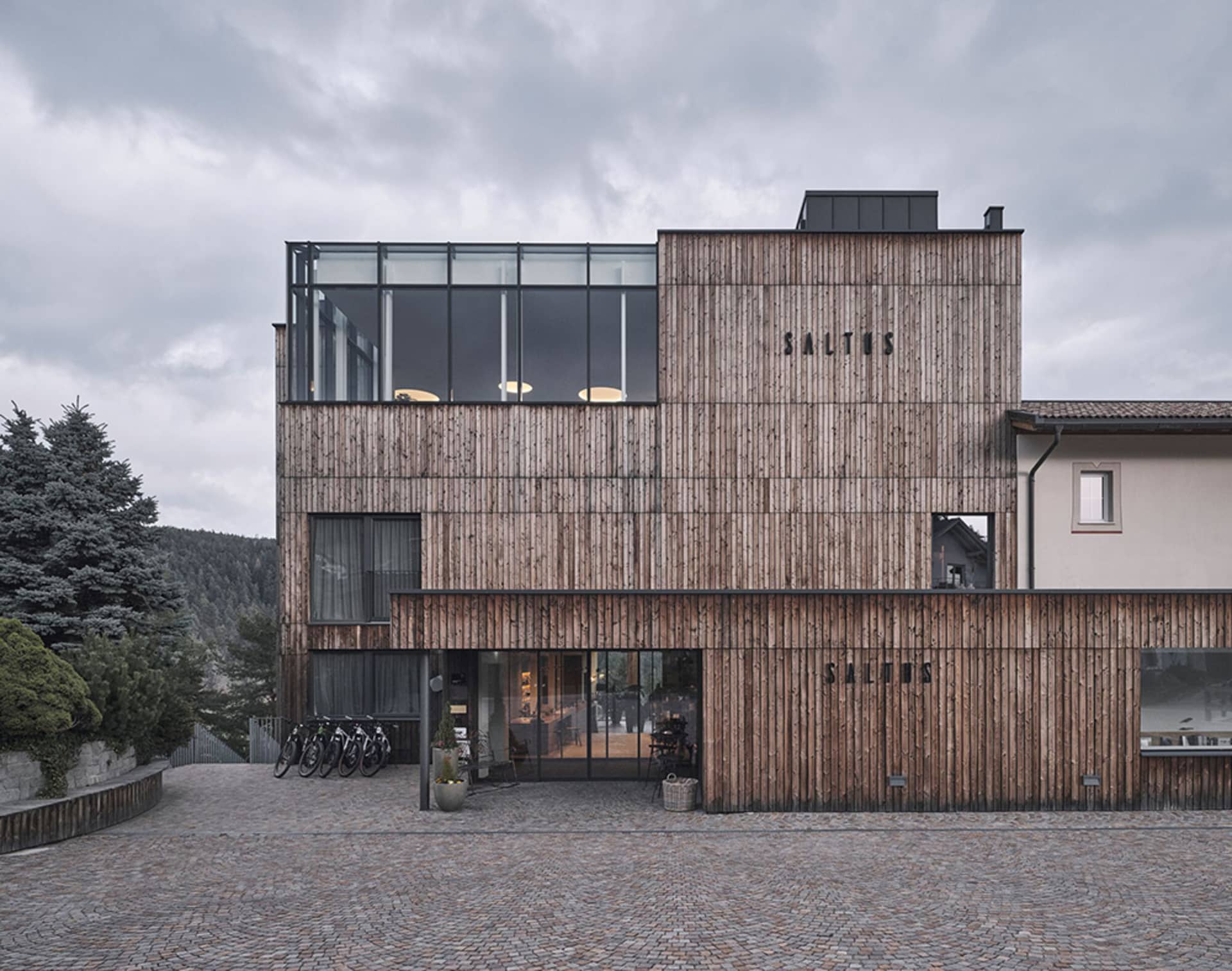 A modern office building with a wooden exterior and glass windows.