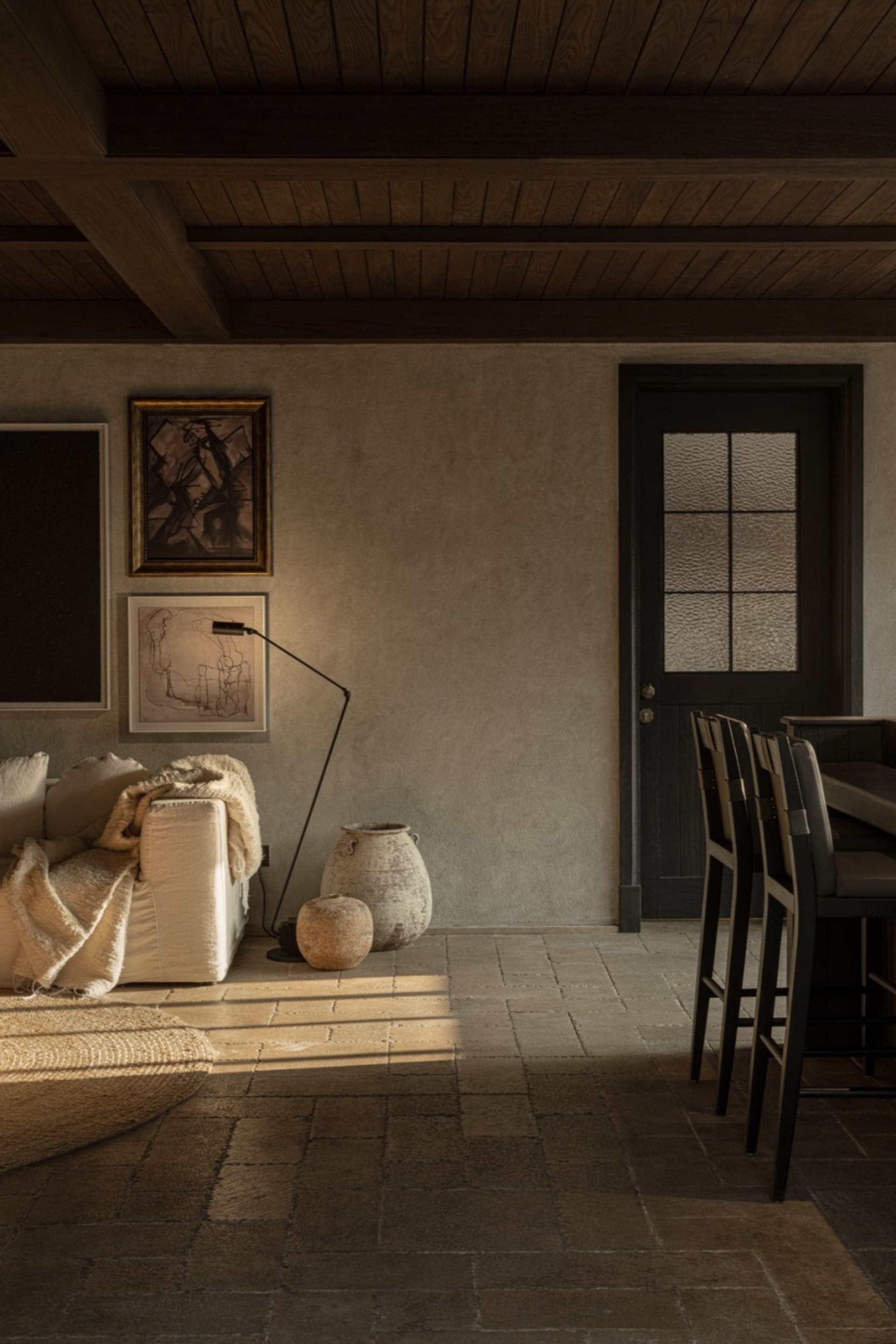Industrial living room with concrete walls and minimalist decor.