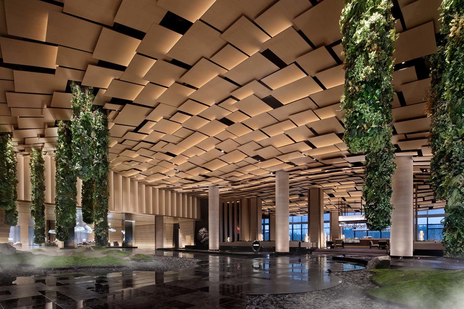 Modern hotel lobby featuring a contemporary design with wooden elements.