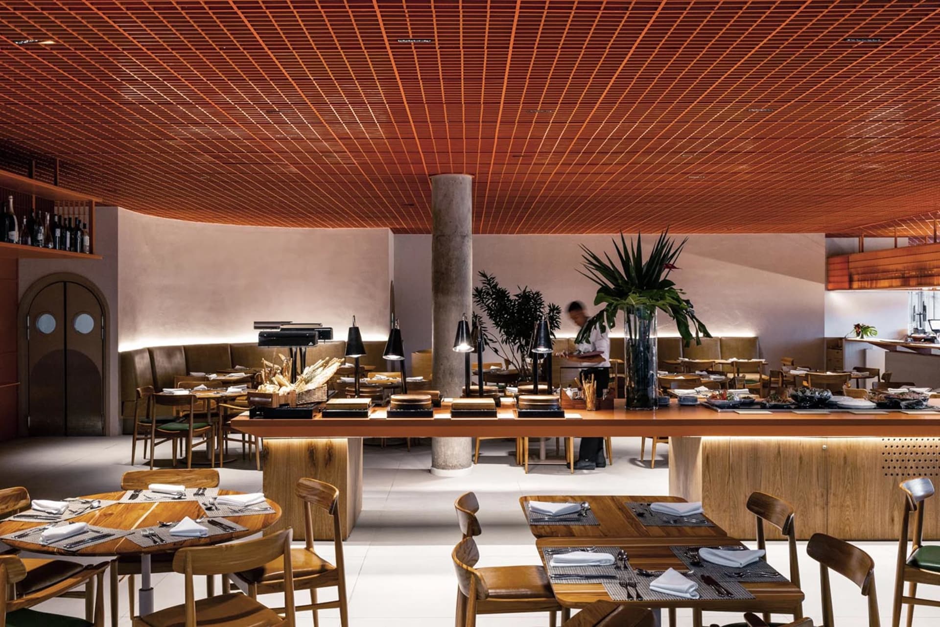 Industrial-themed restaurant interior featuring wooden furniture and materials.