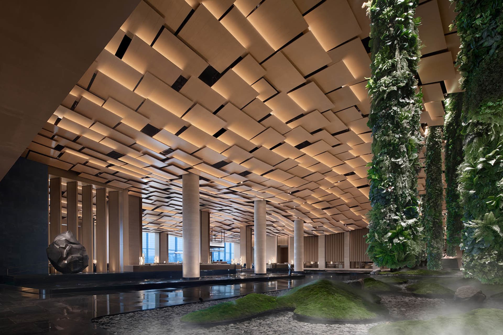 A modern hotel lobby featuring a wooden interior design.