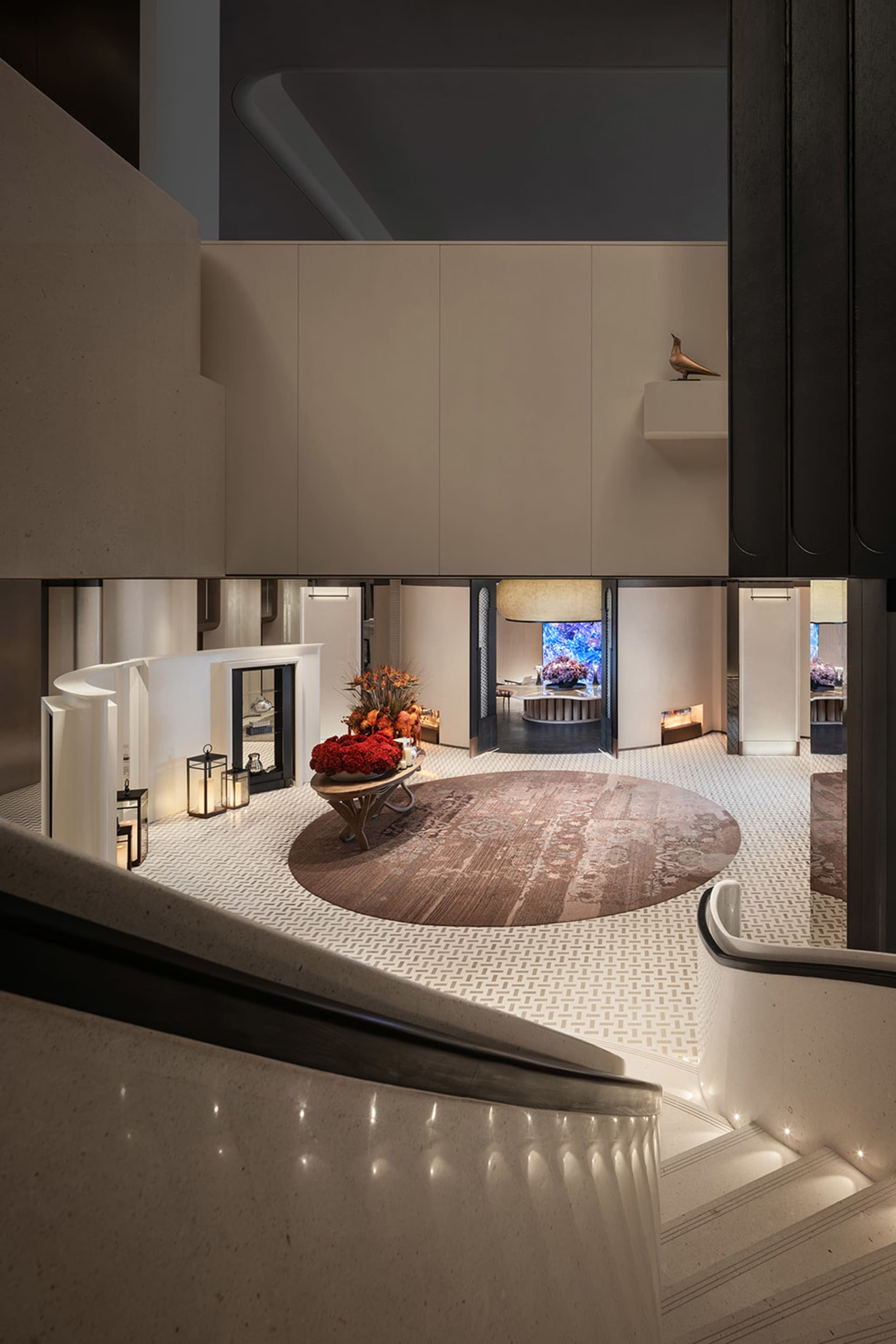 Modern lobby featuring marble floors and concrete accents