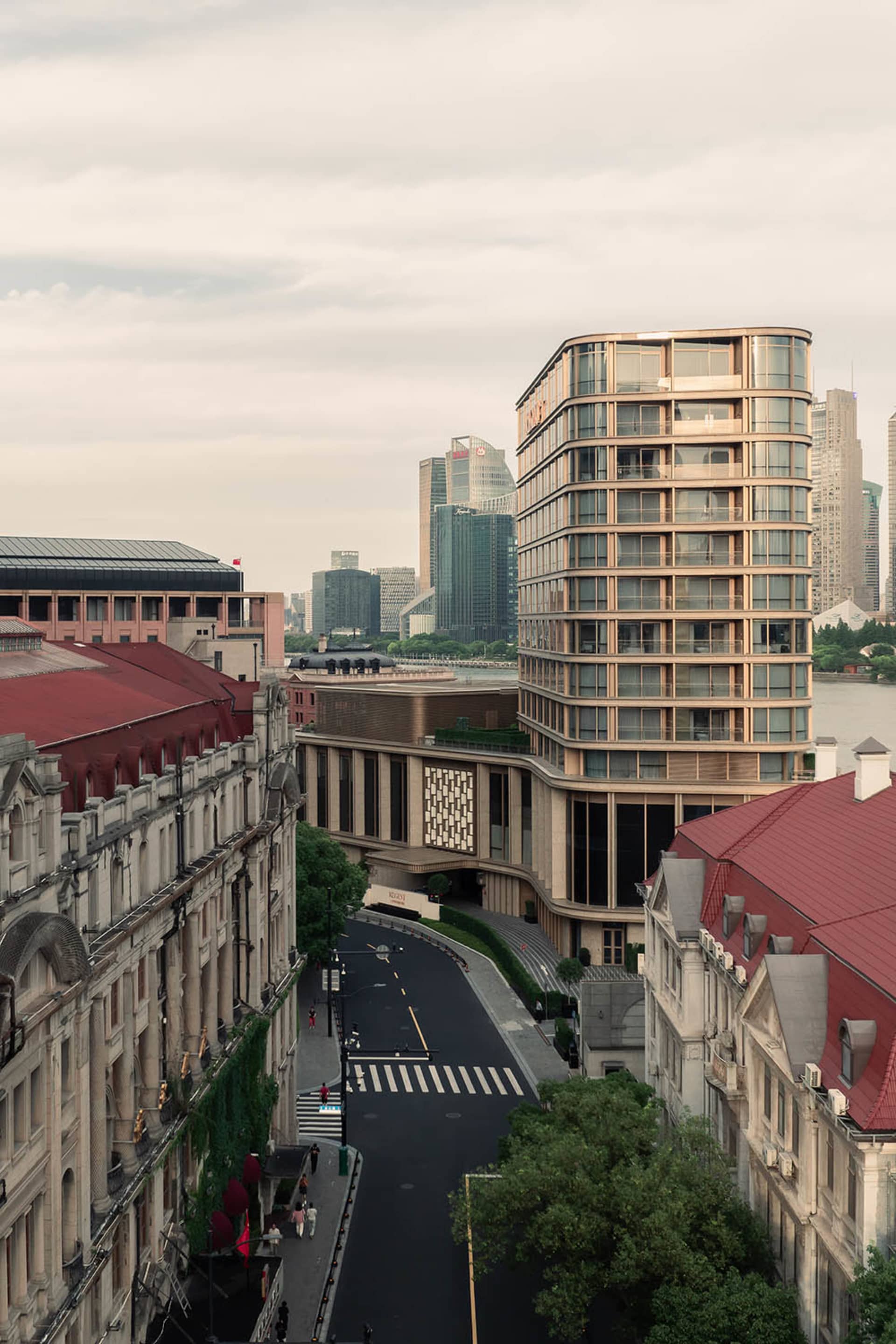 A modern cityscape featuring tall buildings constructed with glass, concrete, and steel.