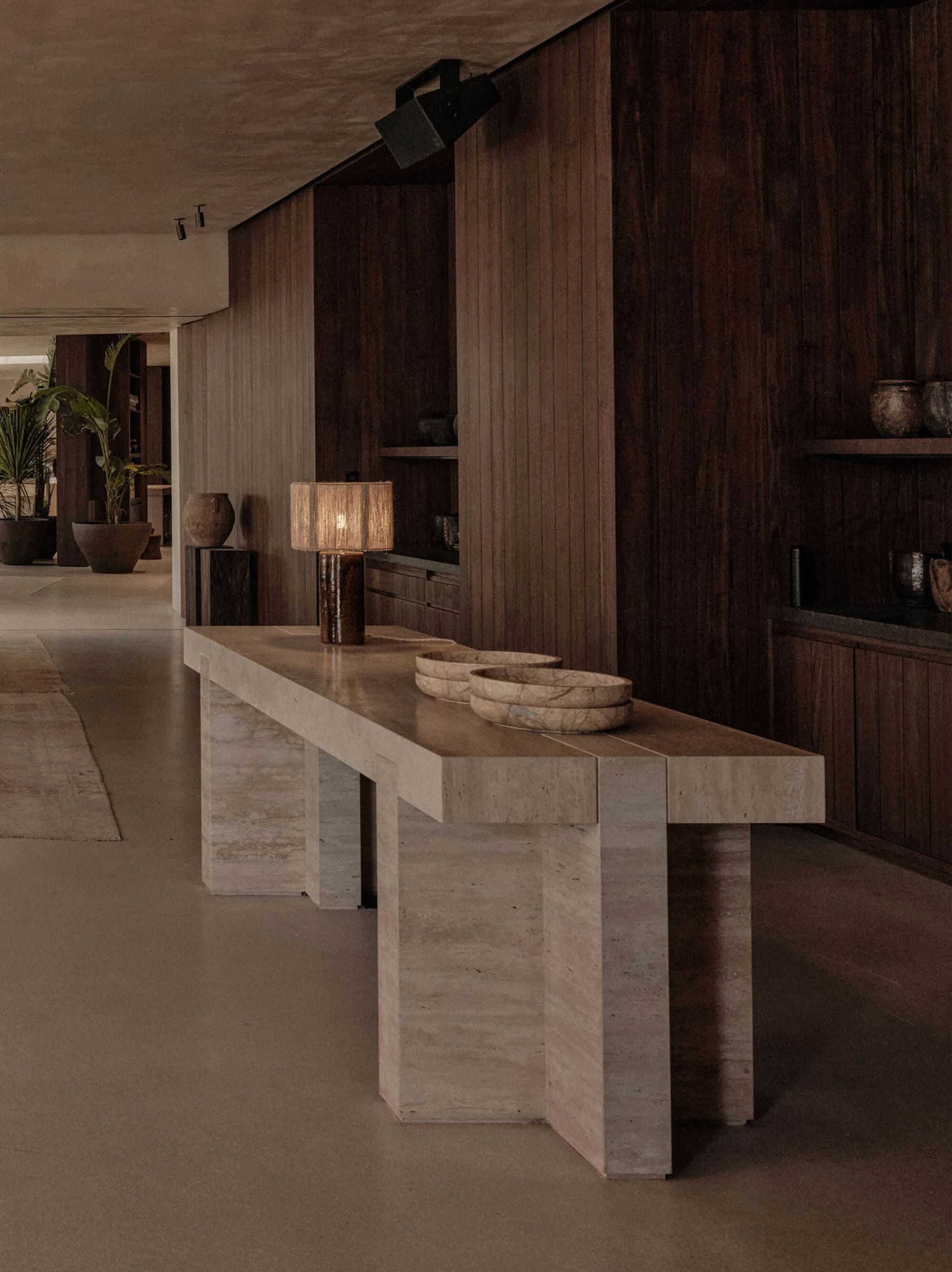 Modern interior space featuring wooden flooring and minimalist furniture.